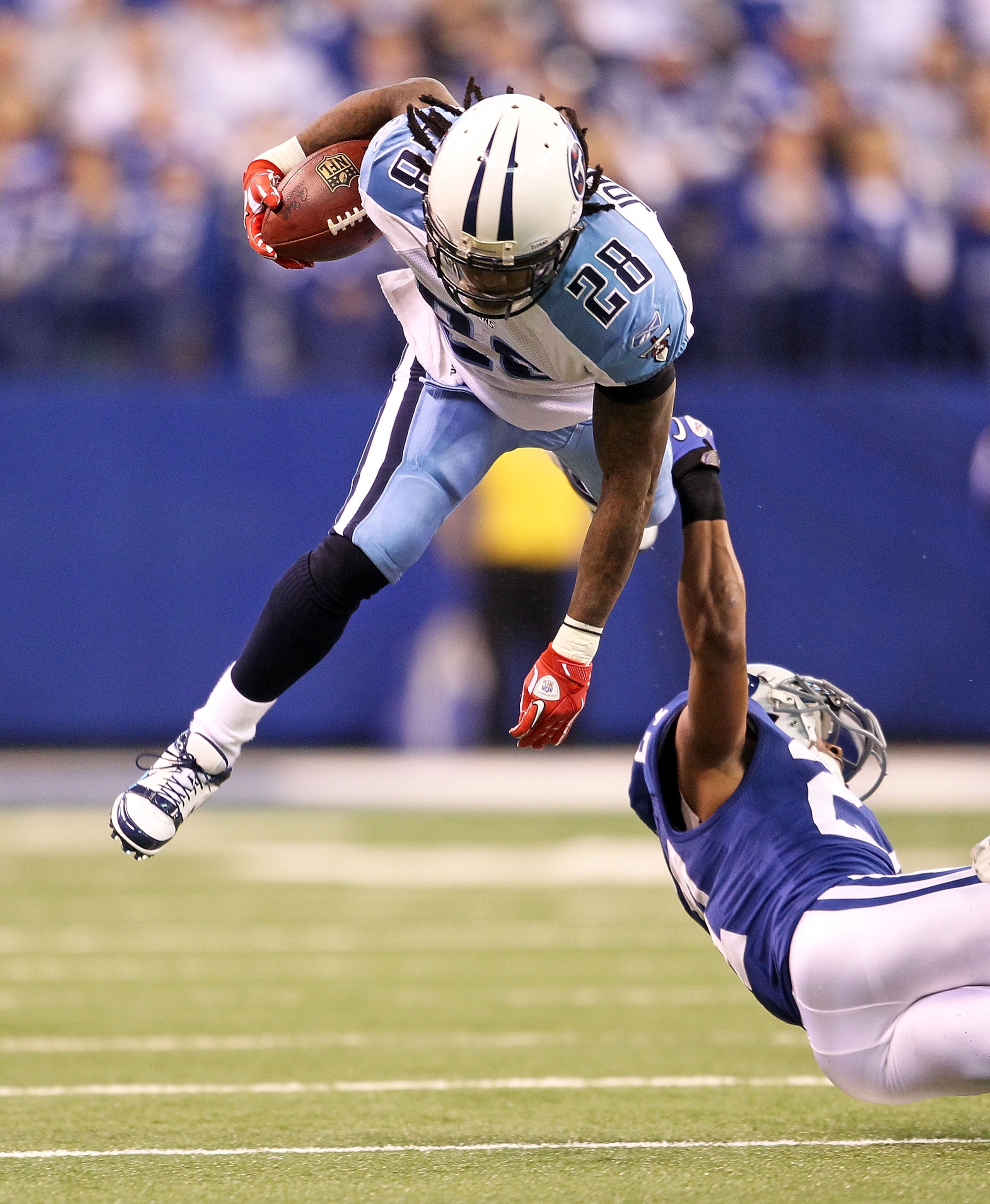 INDIANAPOLIS - JANUARY 02: Chris Johnson #28 of the Tennessee Titans is tackled by Jacob Lacey #27 of the Indianapolis Colts at Lucas Oil Stadium on January 2, 2011 in Indianapolis, Indiana. the Colts won 23-20. (Photo by Andy Lyons/Getty Images) INDIANAPOLIS - JANUARY 02: Chris Johnson #28 of the Tennessee Titans is tackled by Jacob Lacey #27 of the Indianapolis Colts at Lucas Oil Stadium on January 2, 2011 in Indianapolis, Indiana. the Colts won 23-20. (Photo by Andy Lyons/Getty Images)