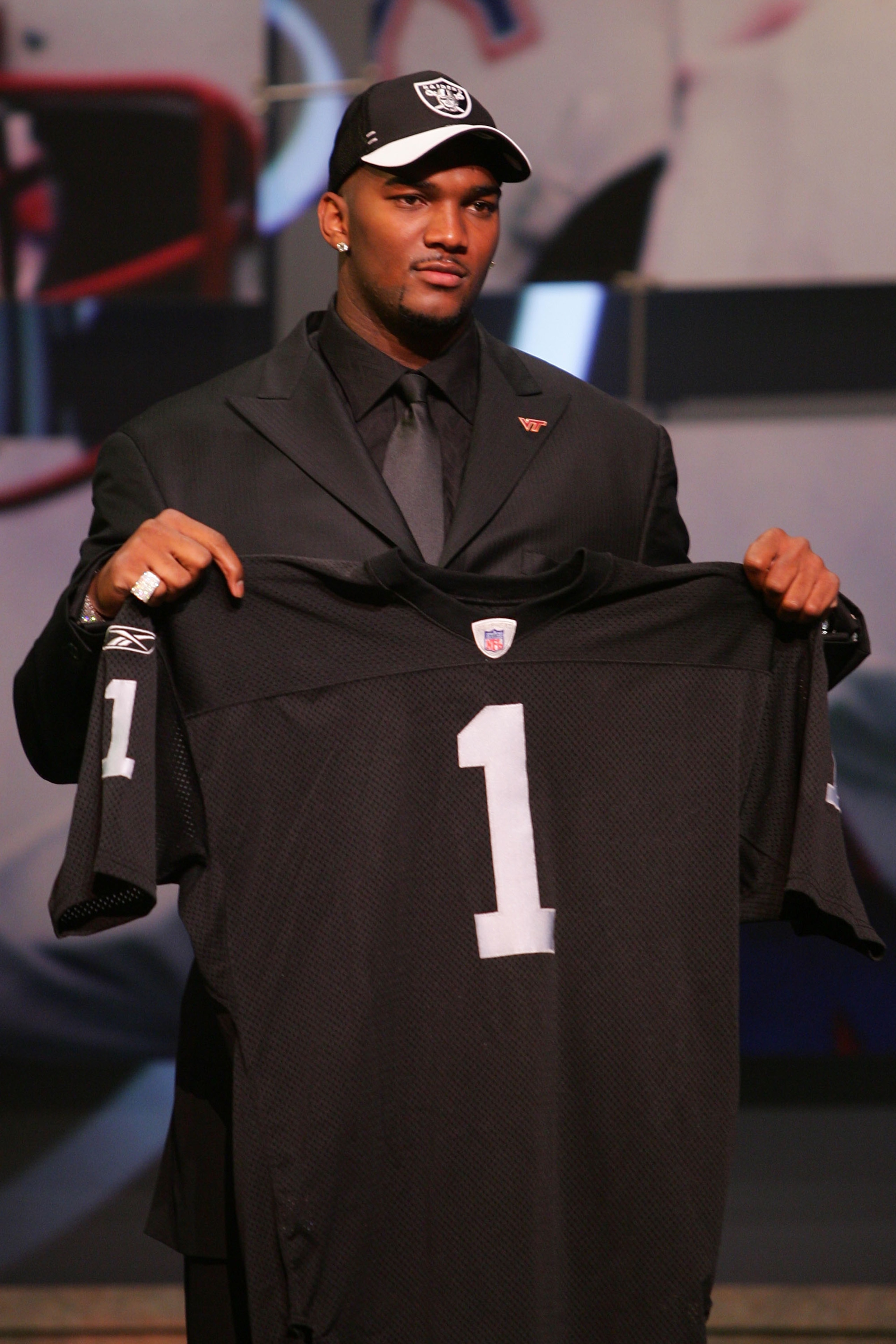 NEW YORK - APRIL 28: Quarterback JaMarcus Russell of Louisiana State University poses for a photo with the Oakland Raiders jersey after being drafted first overall by the Raiders during the 2007 NFL Draft on April 28, 2007 at Radio City Music Hall in New NEW YORK - APRIL 28: Quarterback JaMarcus Russell of Louisiana State University poses for a photo with the Oakland Raiders jersey after being drafted first overall by the Raiders during the 2007 NFL Draft on April 28, 2007 at Radio City Music Hall in New