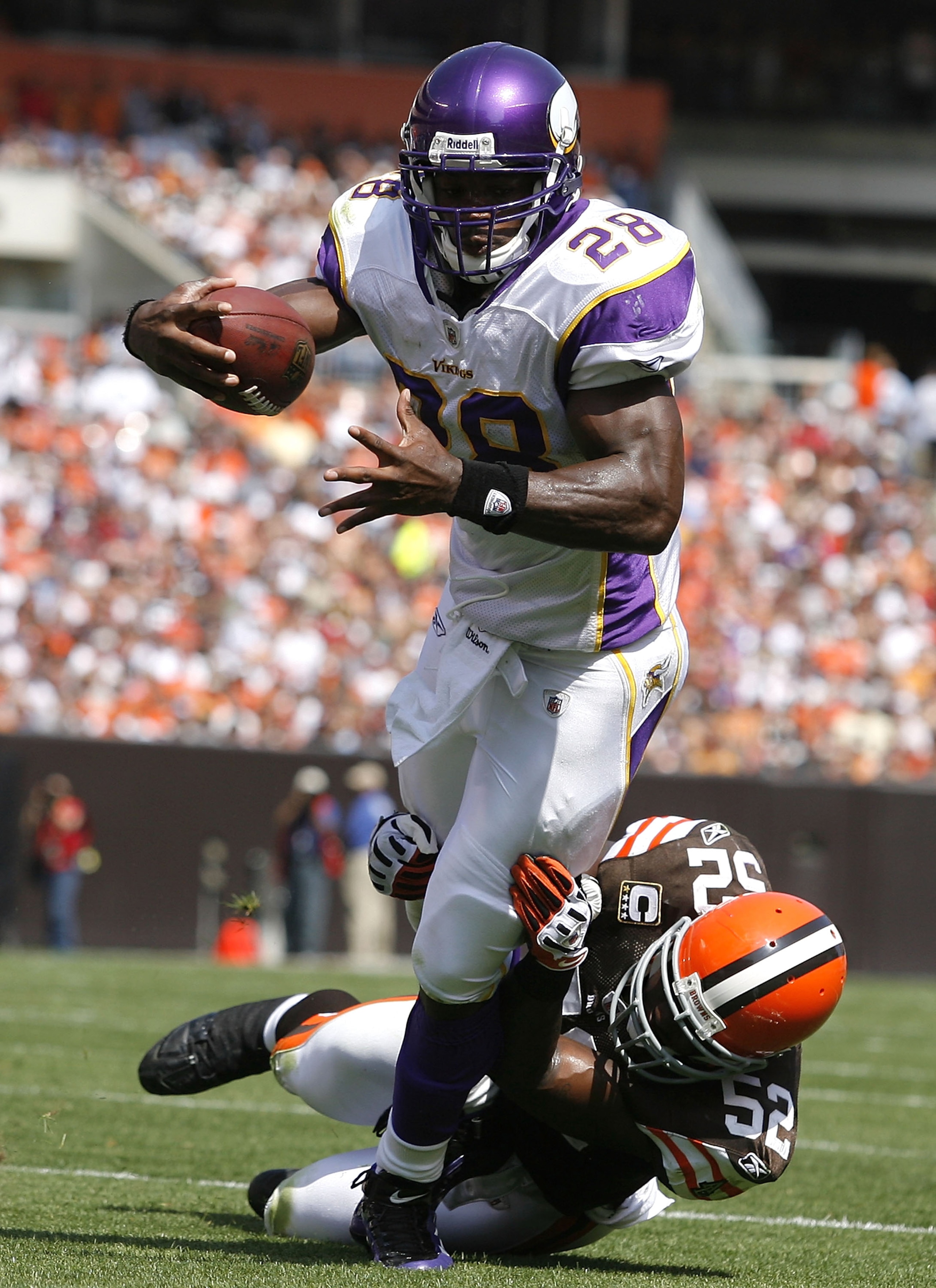 CLEVELAND - SEPTEMBER 13: Adrian Peterson #28 of the Minnesota Vikings is hit by D'Qwell Jackson #52 of the Cleveland Brwons at Cleveland Browns Stadium on September 13, 2009 in Cleveland, Ohio. (Photo by Matt Sullivan/Getty Images) CLEVELAND - SEPTEMBER 13: Adrian Peterson #28 of the Minnesota Vikings is hit by D'Qwell Jackson #52 of the Cleveland Brwons at Cleveland Browns Stadium on September 13, 2009 in Cleveland, Ohio. (Photo by Matt Sullivan/Getty Images)