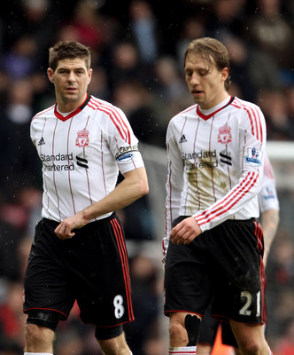 LONDON, ENGLAND - FEBRUARY 27:  Steven Gerrard and teammate Lucas Leiva of Liverpool leave the pitch dejected at half time during the Barclays Premier League match between West Ham United and Liverpool at the Boleyn Ground on February 27, 2011 in London,