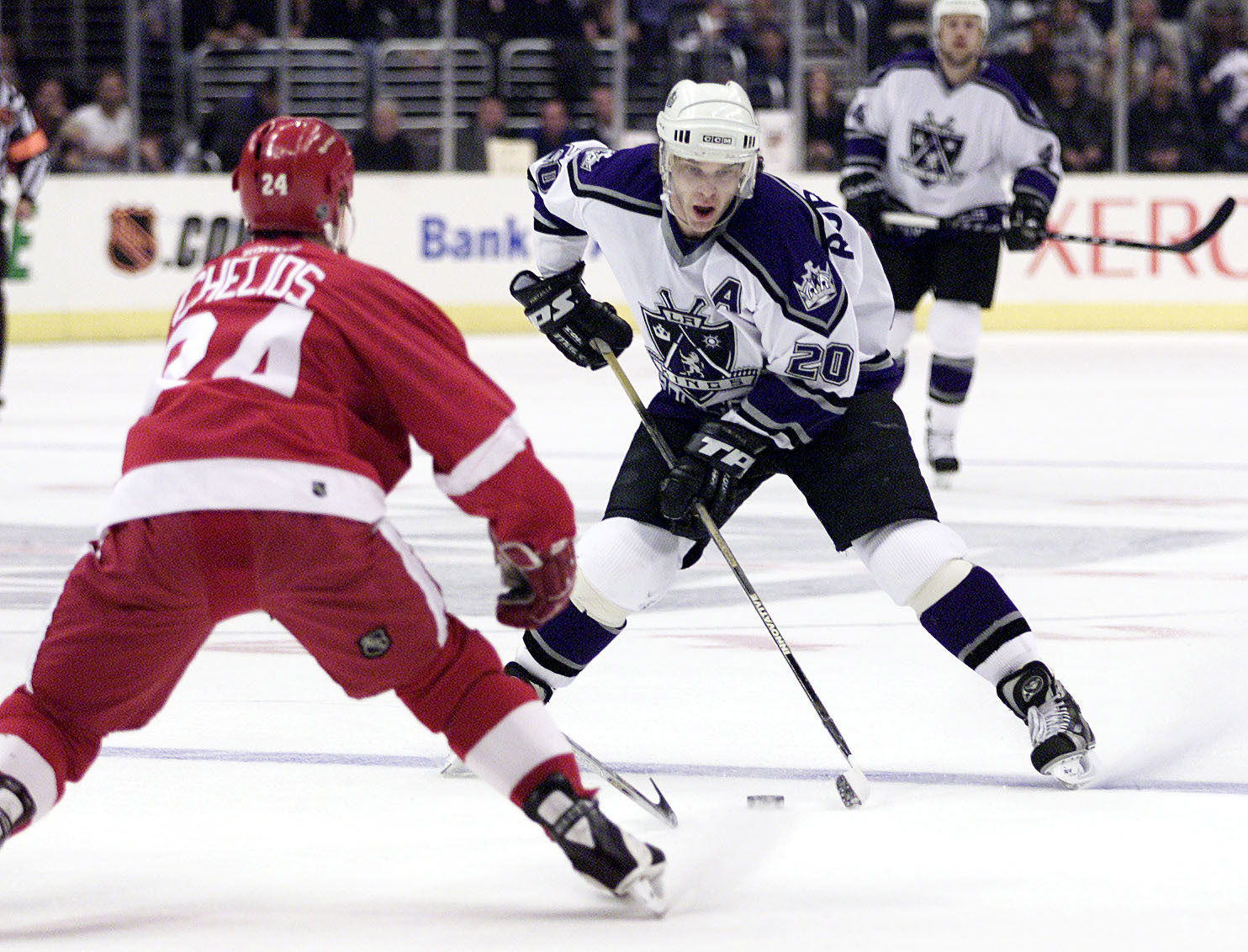 23 Apr 2001: Luc Robitaille #20 of the Los Angeles Kings moves the puck against the defense of Chris Chelios #20 of the Detroit Red Wings in Game Six of the NHL Western Conference Playoffs Quarterfinals at the Staples Center in Los Angeles, California. DI