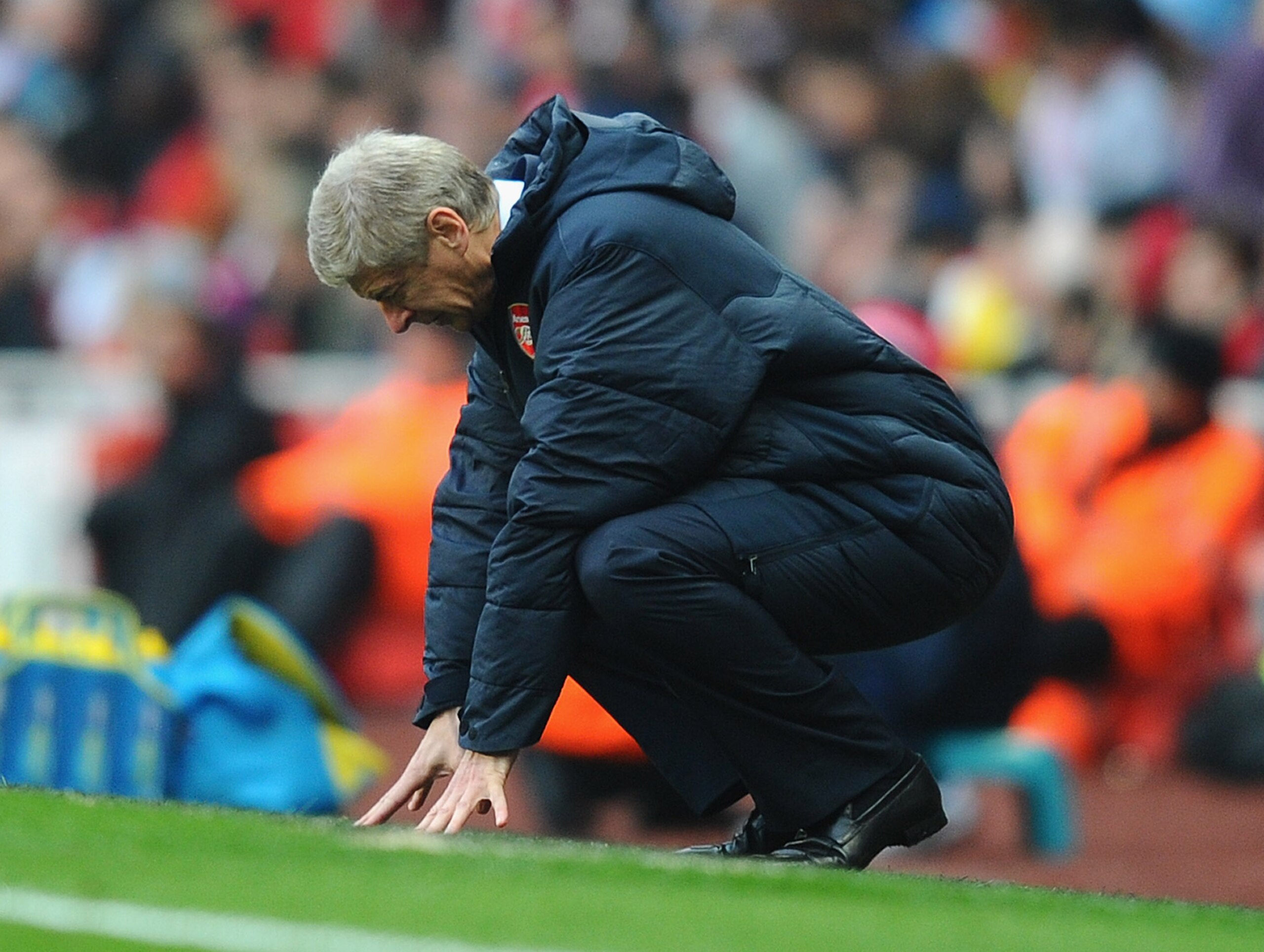 LONDON, ENGLAND - NOVEMBER 20: Arsenal manager Arsene Wenger reacts to Tottenham's winning goal during the Barclays Premier League match between Arsenal and Tottenham Hotspur at the Emirates Stadium on November 20, 2010 in London, England. (Photo by Mik LONDON, ENGLAND - NOVEMBER 20: Arsenal manager Arsene Wenger reacts to Tottenham's winning goal during the Barclays Premier League match between Arsenal and Tottenham Hotspur at the Emirates Stadium on November 20, 2010 in London, England. (Photo by Mik