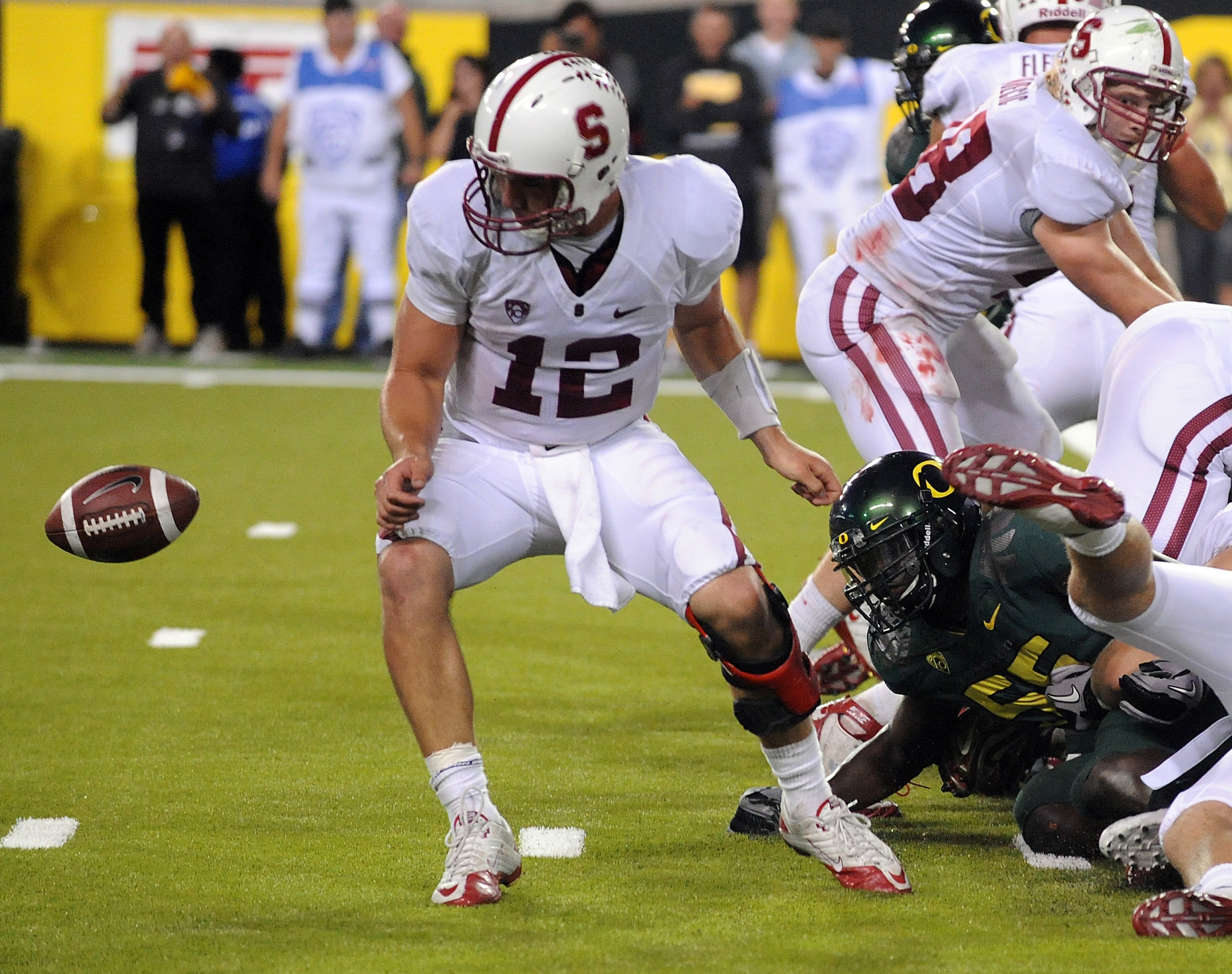 EUGENE, OR - OCTOBER 2: Quarterback Andrew Luck of the Stanford Cardinal can't find the ball as he fumbles it near the goal line in the fourth quarter of the game against the the Oregon Ducks at Autzen Stadium on October 2, 2010 in Eugene, Oregon. Oregon