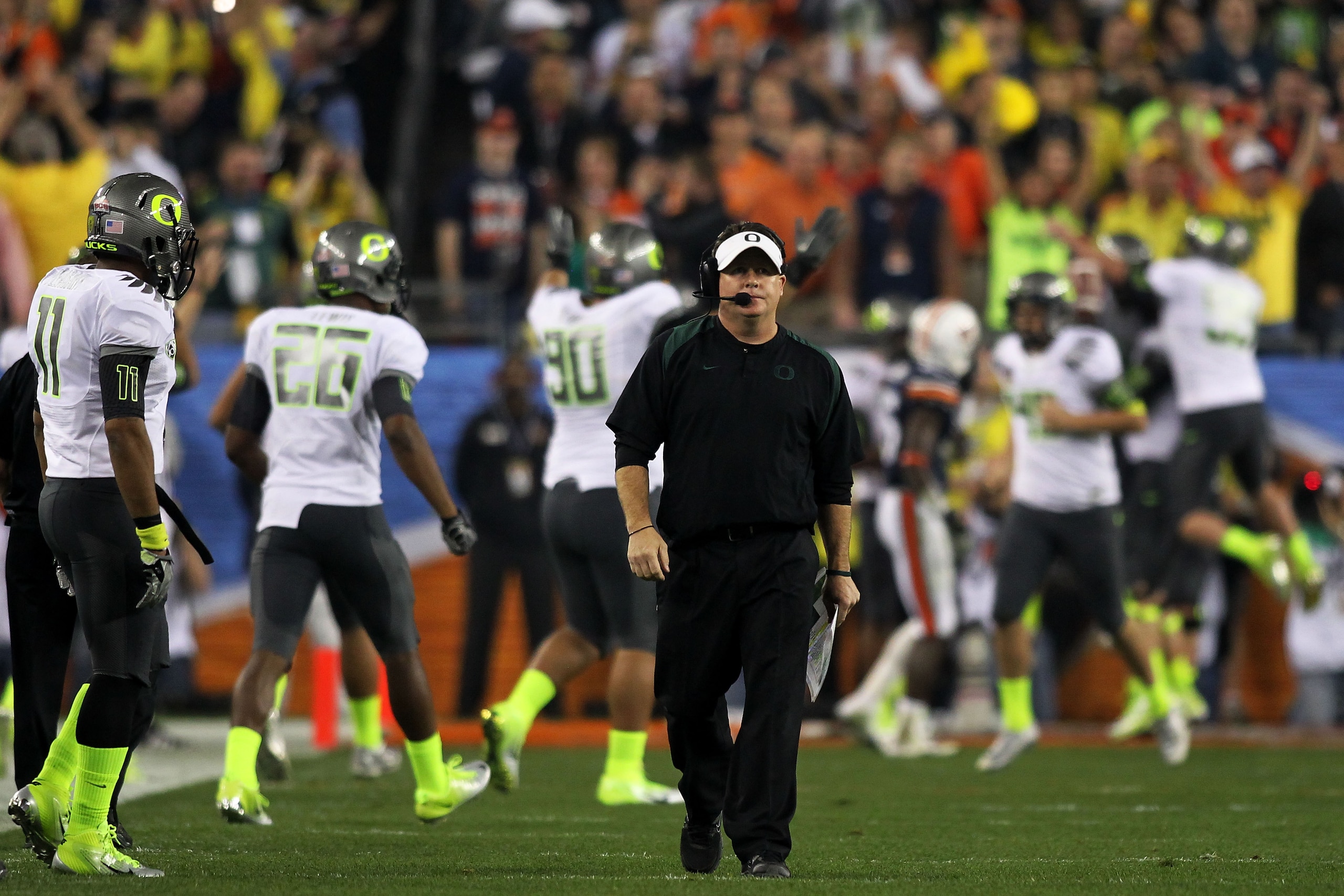 GLENDALE, AZ - JANUARY 10:  Head coach Chip Kelly of the Oregon Ducks waslks down the sideline after his Ducks scored a second quater touchdown against the Auburn Tigers in the Tostitos BCS National Championship Game at University of Phoenix Stadium on Ja