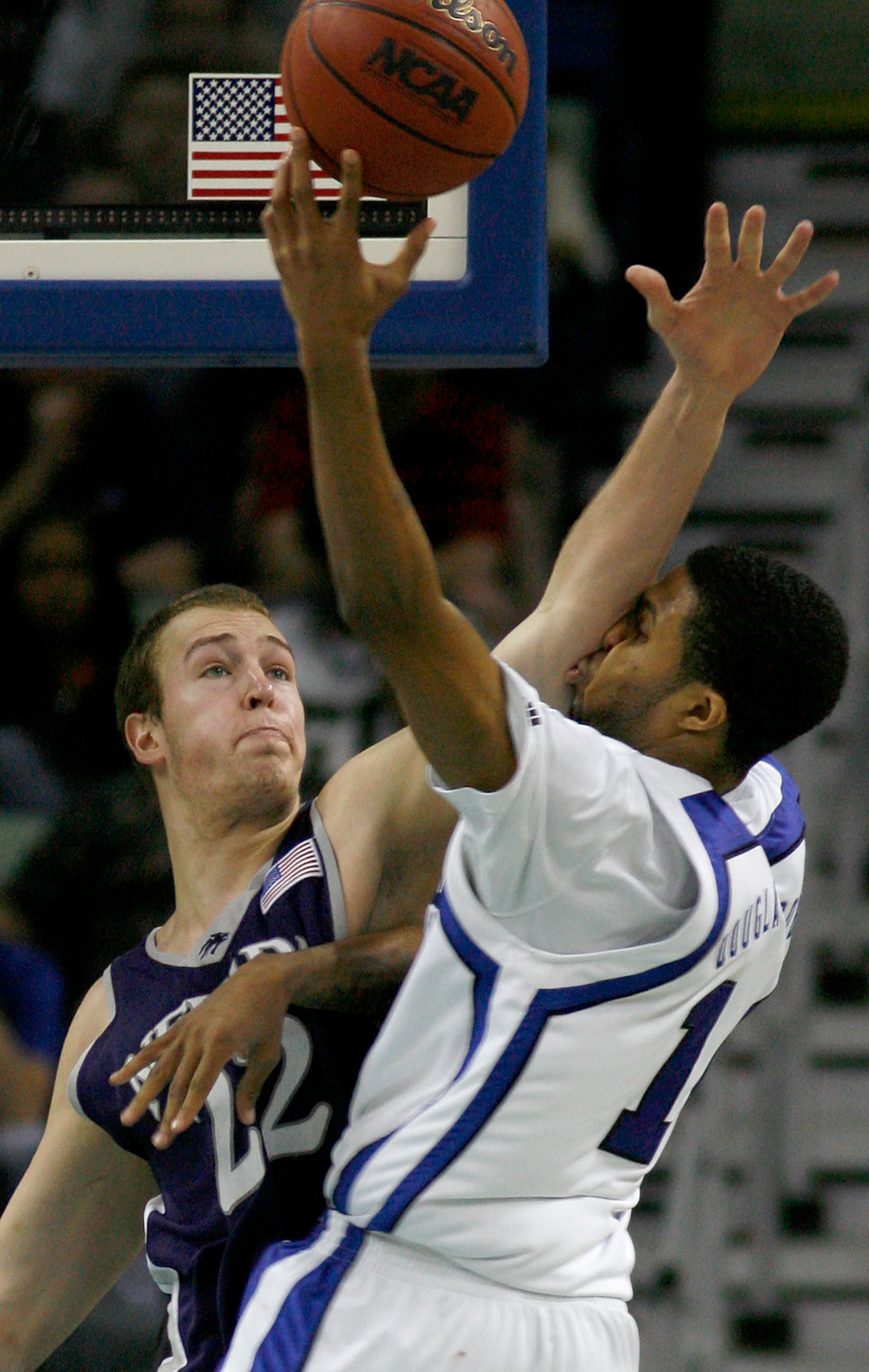 NEW ORLEANS - MARCH 18:  Nick Fazekas #22 of the Nevada Wolf Pack and Chris Douglas-Roberts #14 of the Memphis Tigers clash during round two of the NCAA Men's Basketball Tournament at the New Orleans Arena on March 18, 2007 in New Orleans, Louisiana.  (Ph