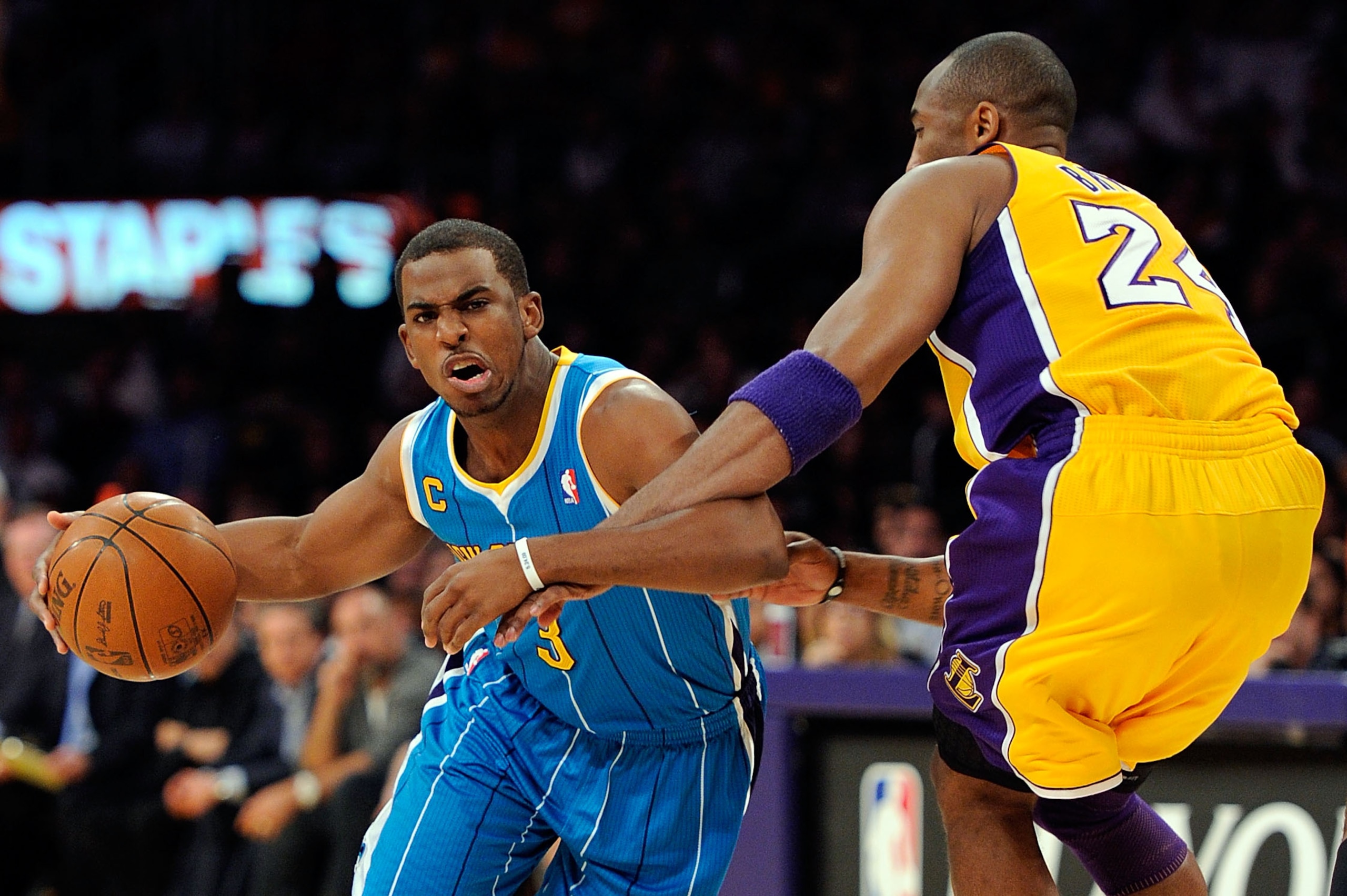 LOS ANGELES, CA - APRIL 20:  Chris Paul #3 of the New Orleans Hornets drives on Kobe Bryant #24 of the Los Angeles Lakers in the first quarter in Game Two of the Western Conference Quarterfinals in the 2011 NBA Playoffs on April 20, 2011 at Staples Center