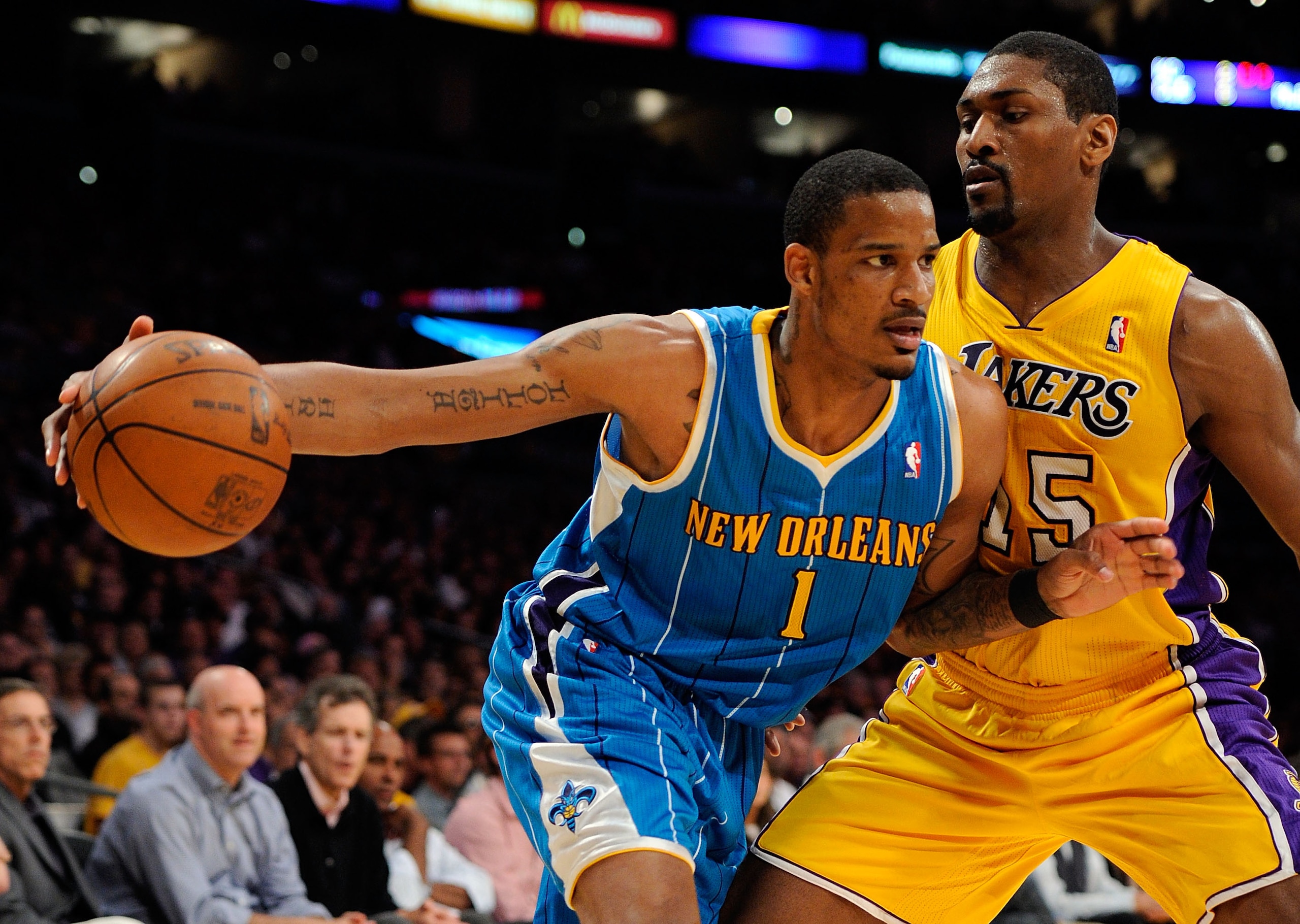 LOS ANGELES, CA - APRIL 20:  Trevor Ariza #1 of the New Orleans Hornets drives on Ron Artest #15 of the Los Angeles Lakers in the first quarter in Game Two of the Western Conference Quarterfinals in the 2011 NBA Playoffs on April 20, 2011 at Staples Cente