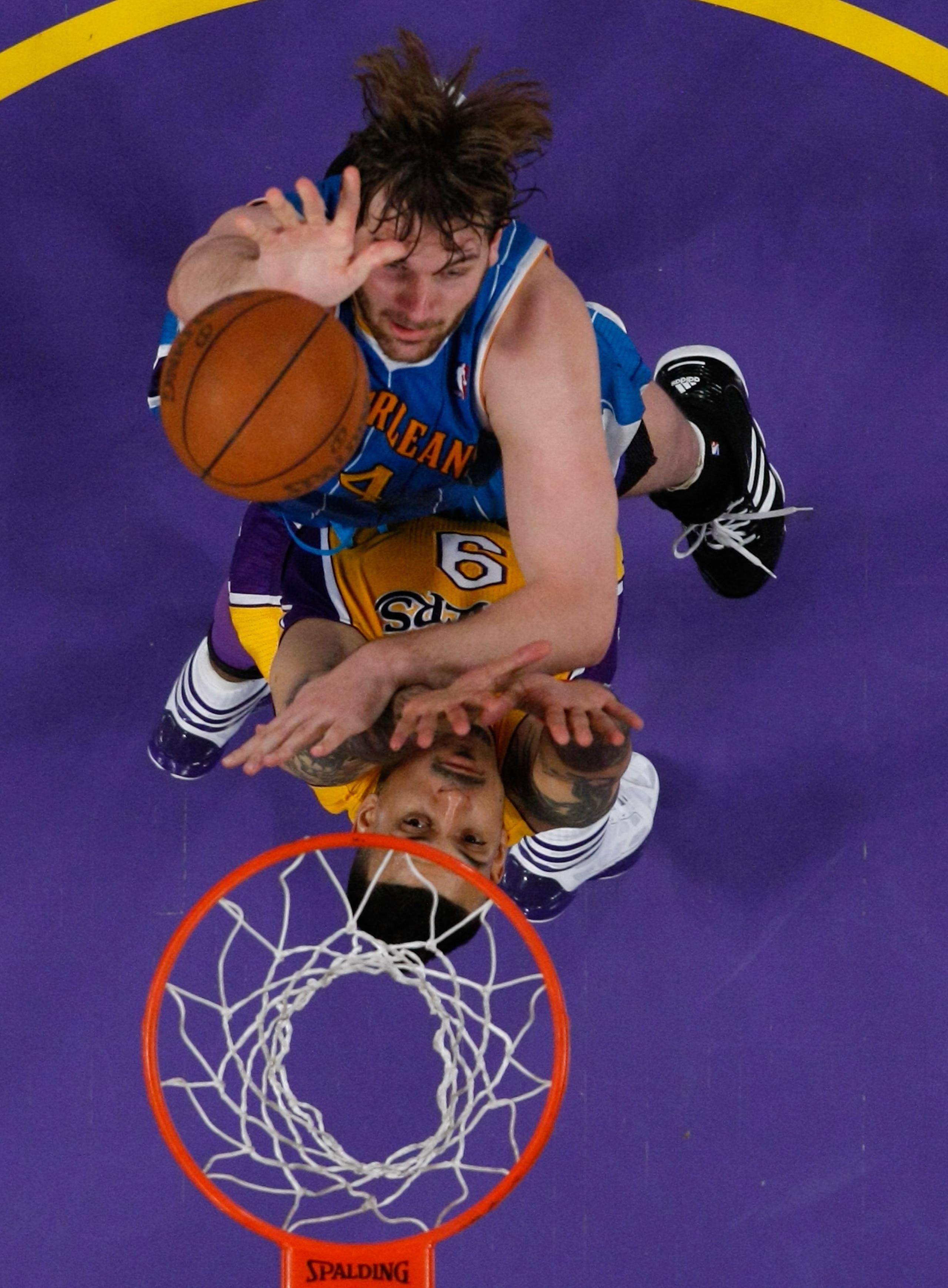LOS ANGELES, CA - APRIL 20:  Aaron Gray #34 of the New Orleans Hornets goes up for a shot over Matt Barnes #9 of the Los Angeles Lakers in Game Two of the Western Conference Quarterfinals in the 2011 NBA Playoffs on April 20, 2011 at Staples Center in Los