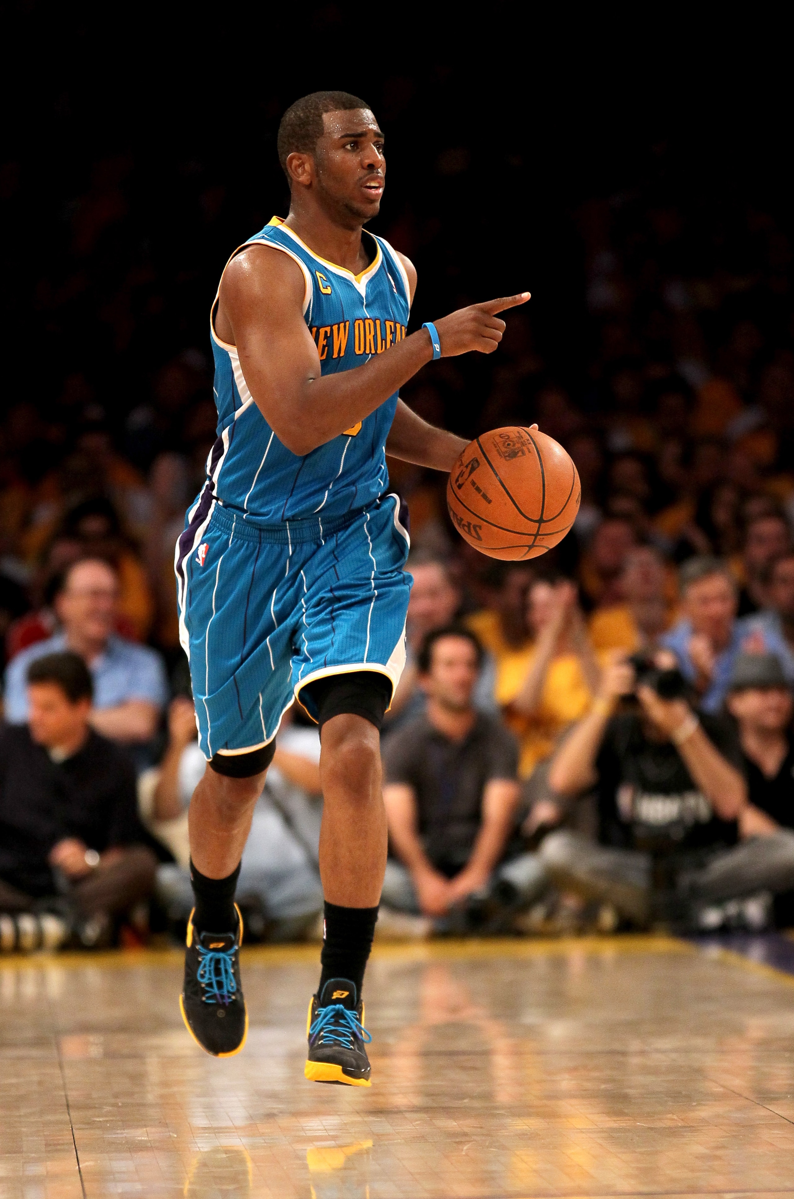 LOS ANGELES, CA - APRIL 17: Chris Paul #3 of the New Orleans Hornets directs the offense as he brings the ball up court against the Los Angeles Lakers in Game One of the Western Conference Quarterfinals in the 2011 NBA Playoffs on April 17, 2011 at Stapl LOS ANGELES, CA - APRIL 17: Chris Paul #3 of the New Orleans Hornets directs the offense as he brings the ball up court against the Los Angeles Lakers in Game One of the Western Conference Quarterfinals in the 2011 NBA Playoffs on April 17, 2011 at Stapl