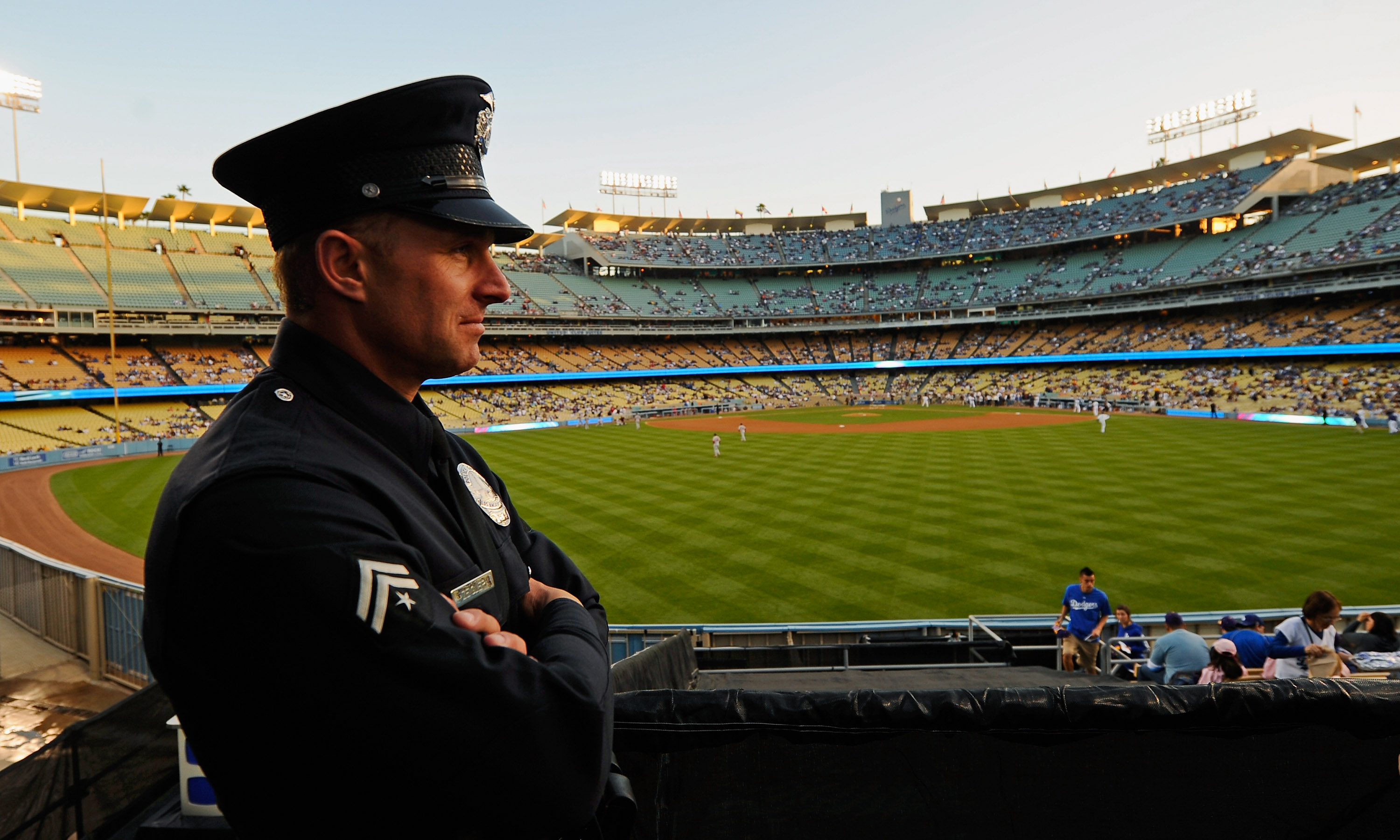 LOS ANGELES, CA - APRIL 14:  A Los Angeles Police Department officer looks out from an outfield pavillion at Dodger Stadium prior to the start of the baseball game between the St. Louis Cardinals and Los Angeles Dodgers on April 14, 2011 in Los Angeles, C