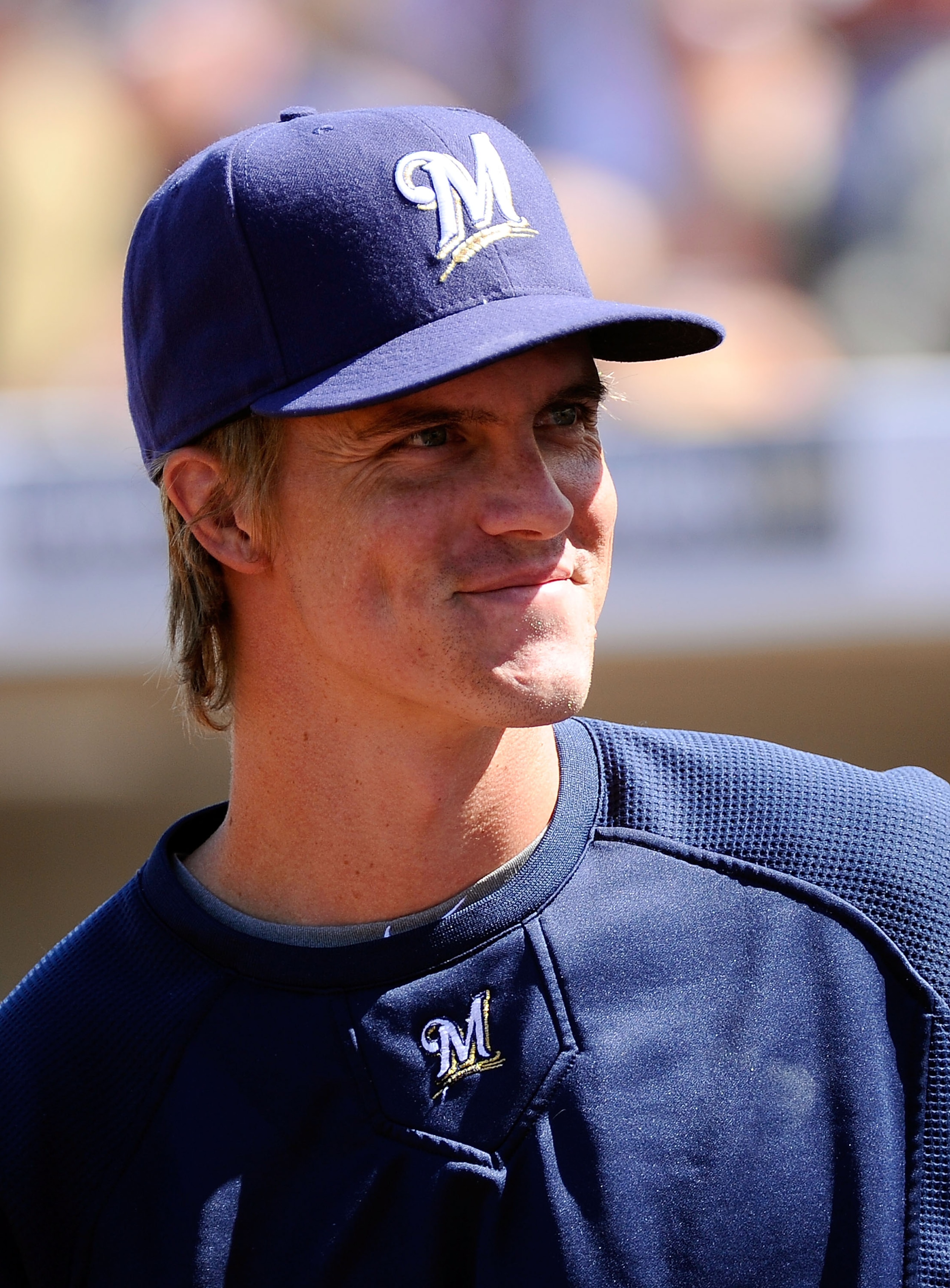 PHOENIX, AZ - MARCH 10:  Pitcher Zack Greinke #13  of the Milwaukee Brewers smiles during the spring training baseball game against Colorado Rockies at Maryvale Baseball Park on March 10, 2011 in Phoenix, Arizona.  (Photo by Kevork Djansezian/Getty Images