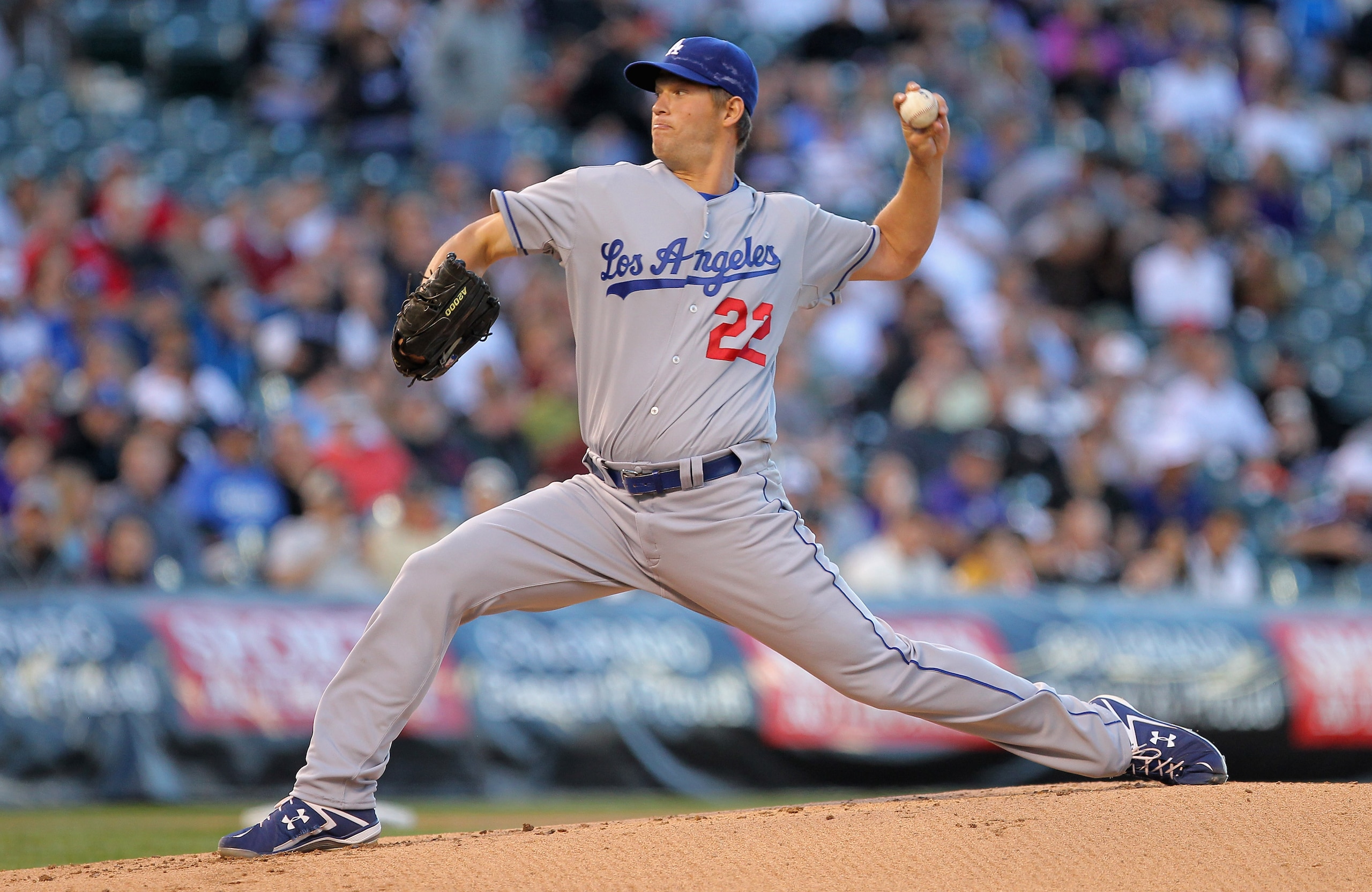 DENVER, CO - APRIL 05:  Starting pitcher Clayton Kershaw #22 of the Los Angeles Dodgers delivers against the Colorado Rockies at Coors Field on April 5, 2011 in Denver, Colorado. Kershaw collected the loss as the Rockies defeated the Dodgers 3-0.  (Photo