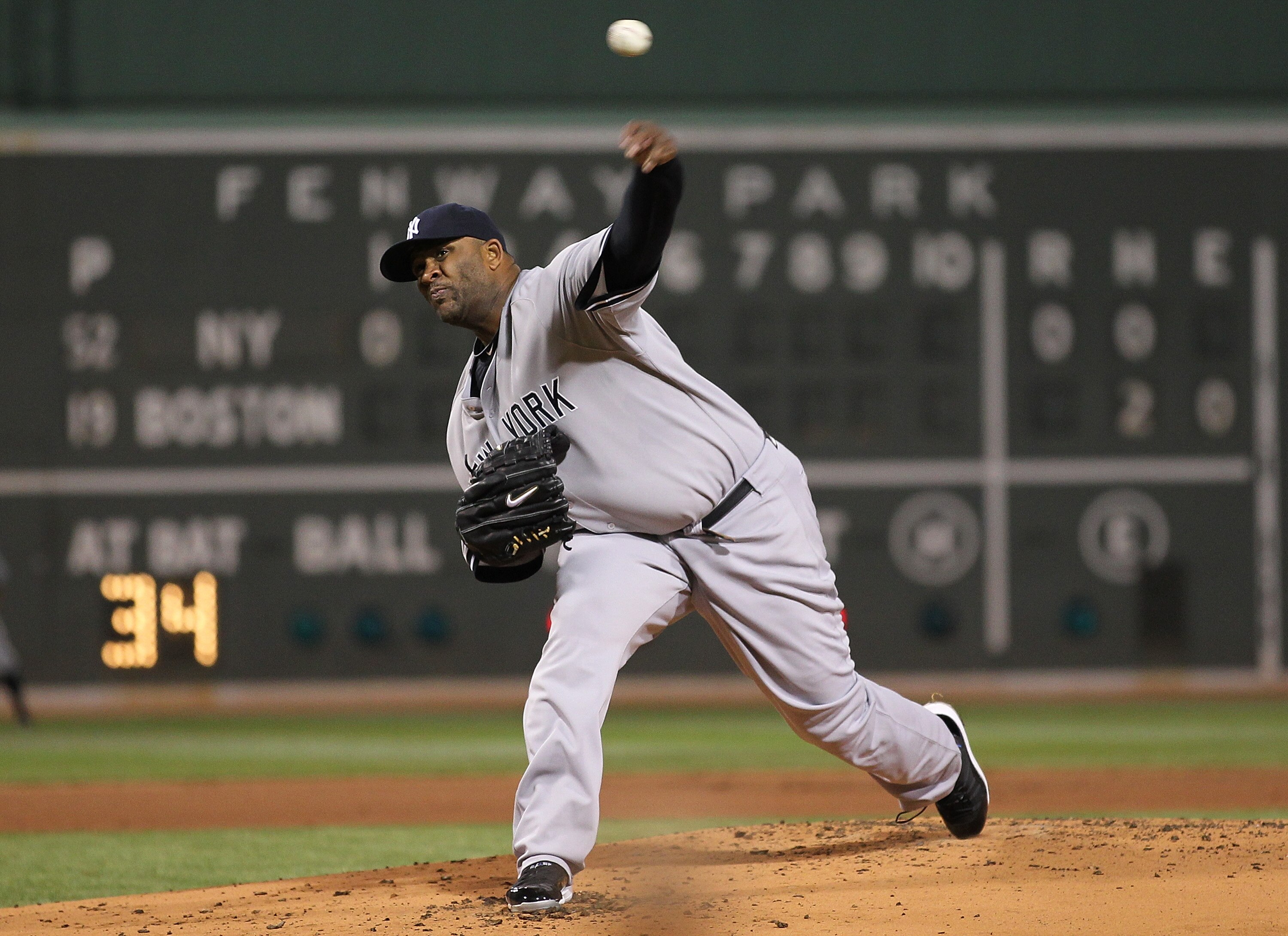 BOSTON, MA - APRIL 10:  CC Sabathia #52 of the New York Yankees throws against the Boston Red Sox at Fenway Park April 10, 2011 in Boston, Massachusetts. (Photo by Jim Rogash/Getty Images)