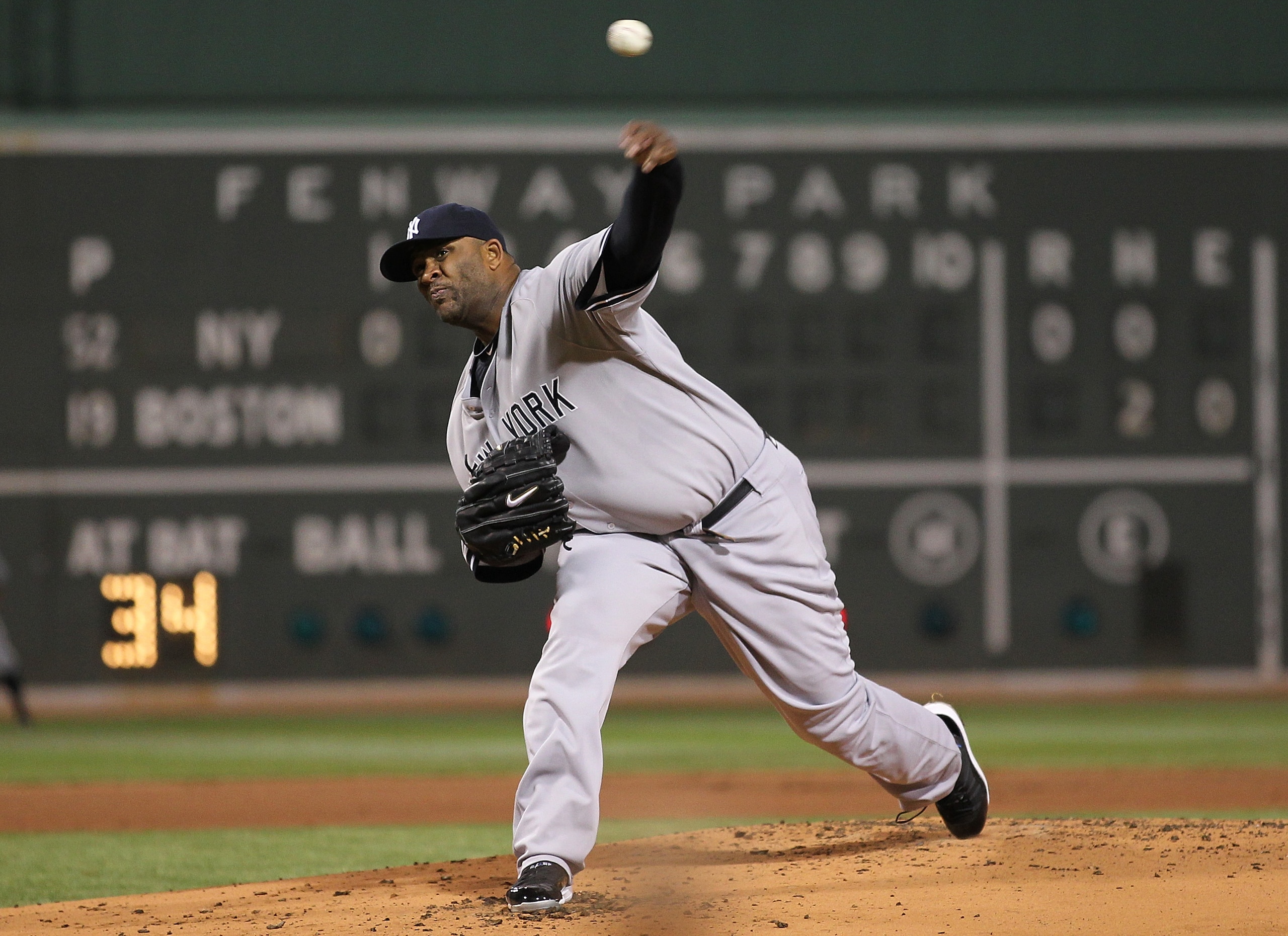 BOSTON, MA - APRIL 10:  CC Sabathia #52 of the New York Yankees throws against the Boston Red Sox at Fenway Park April 10, 2011 in Boston, Massachusetts. (Photo by Jim Rogash/Getty Images)