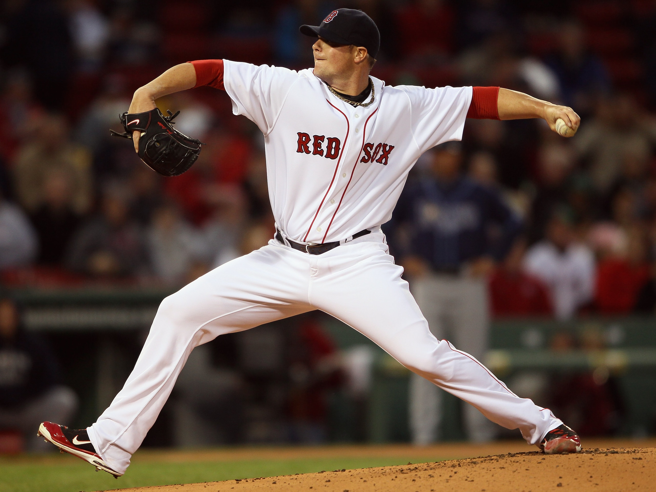 BOSTON, MA - APRIL 12:  Jon Lester #31 of the Boston Red Sox delivers a pitch in the first inning against the Tampa Bay Rays on April 12, 2011 at Fenway Park in Boston, Massachusetts.  (Photo by Elsa/Getty Images)