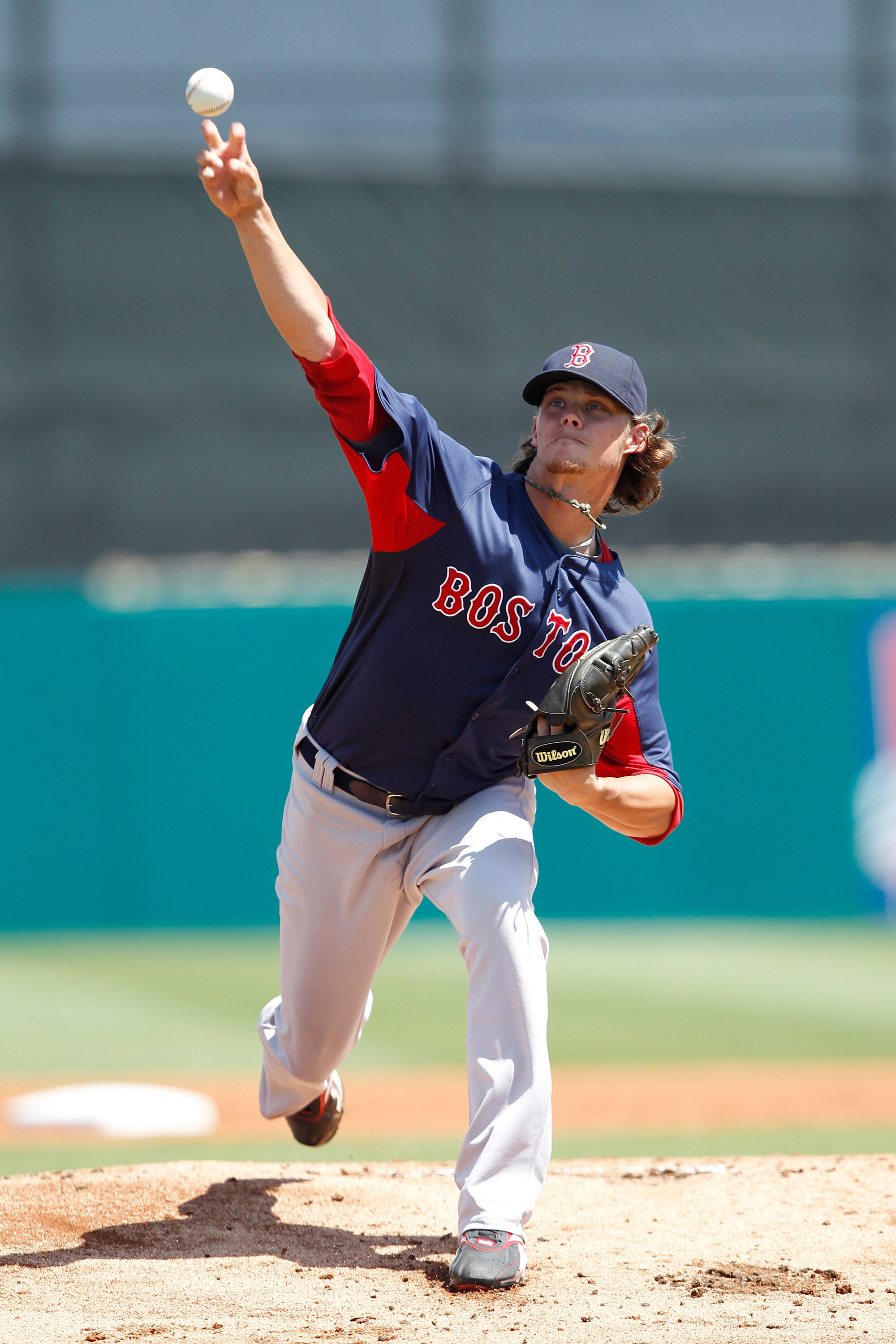 JUPITER, FL - MARCH 24: Clay Buchholz #11 of the Boston Red Sox warms up just prior to the start of the first inning against the Florida Marlins at Roger Dean Stadium on March 24, 2011 in Jupiter, Florida. (Photo by Joel Auerbach/Getty Images)