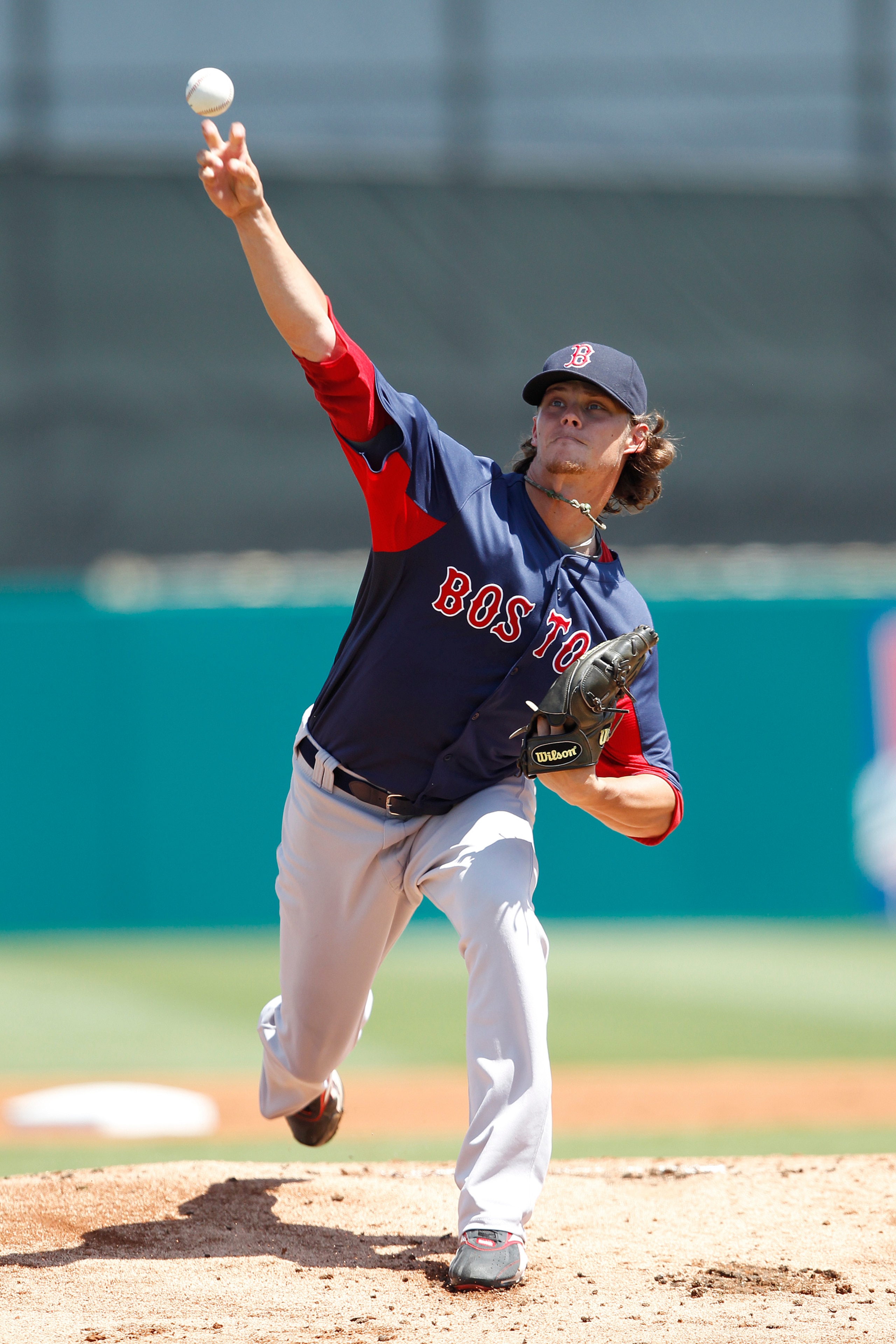 JUPITER, FL - MARCH 24: Clay Buchholz #11 of the Boston Red Sox warms up just prior to the start of the first inning against the Florida Marlins at Roger Dean Stadium on March 24, 2011 in Jupiter, Florida. (Photo by Joel Auerbach/Getty Images)
