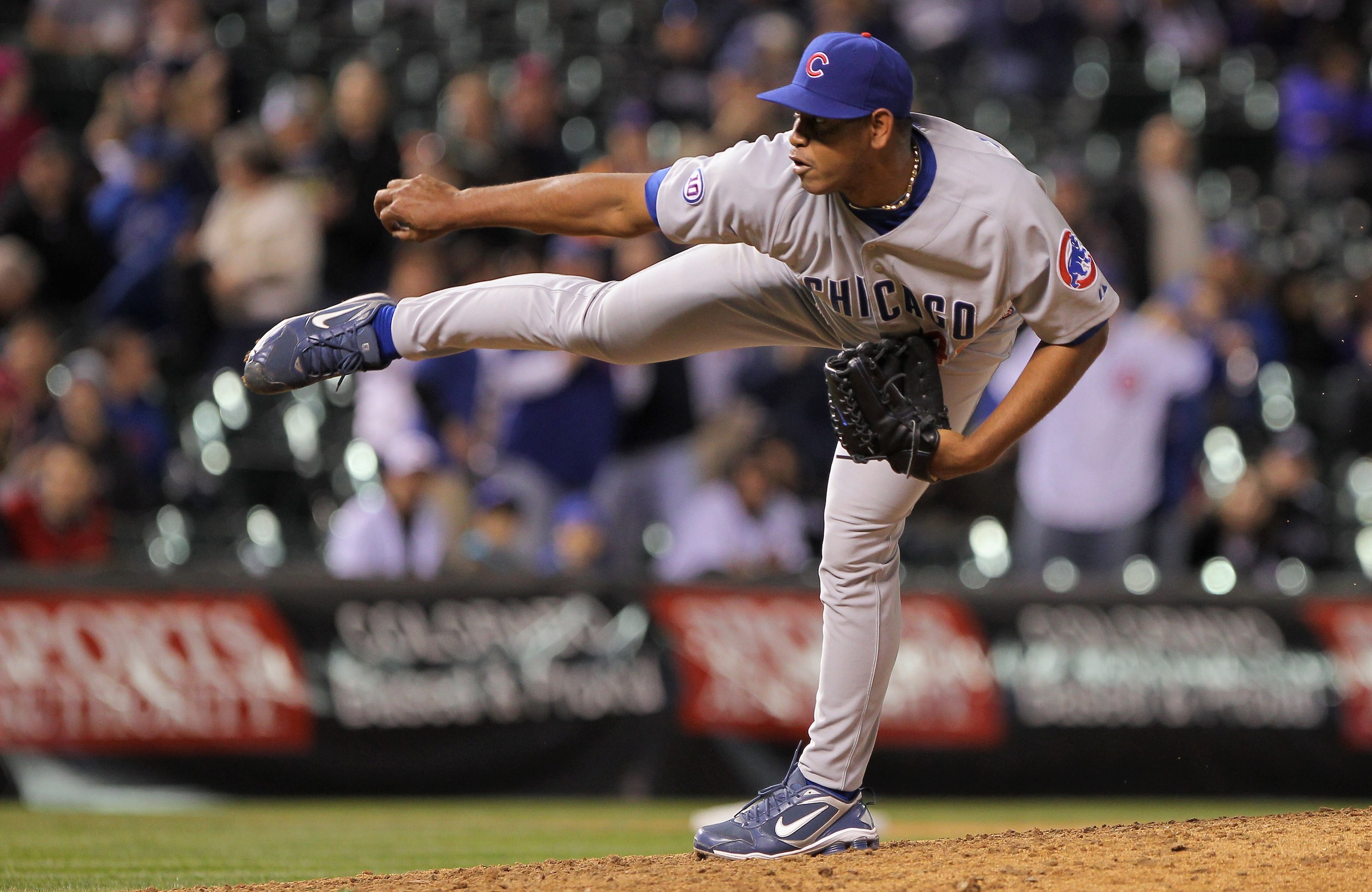 DENVER, CO - APRIL 16:  Pitcher Carlos Marmol #49 of the Chicago Cubs works against the Colorado Rockies in the ninth inning at Coors Field on April 16, 2011 in Denver, Colorado. Marmol earned a save as the Cubs defeated the Rockies 8-3.  (Photo by Doug P