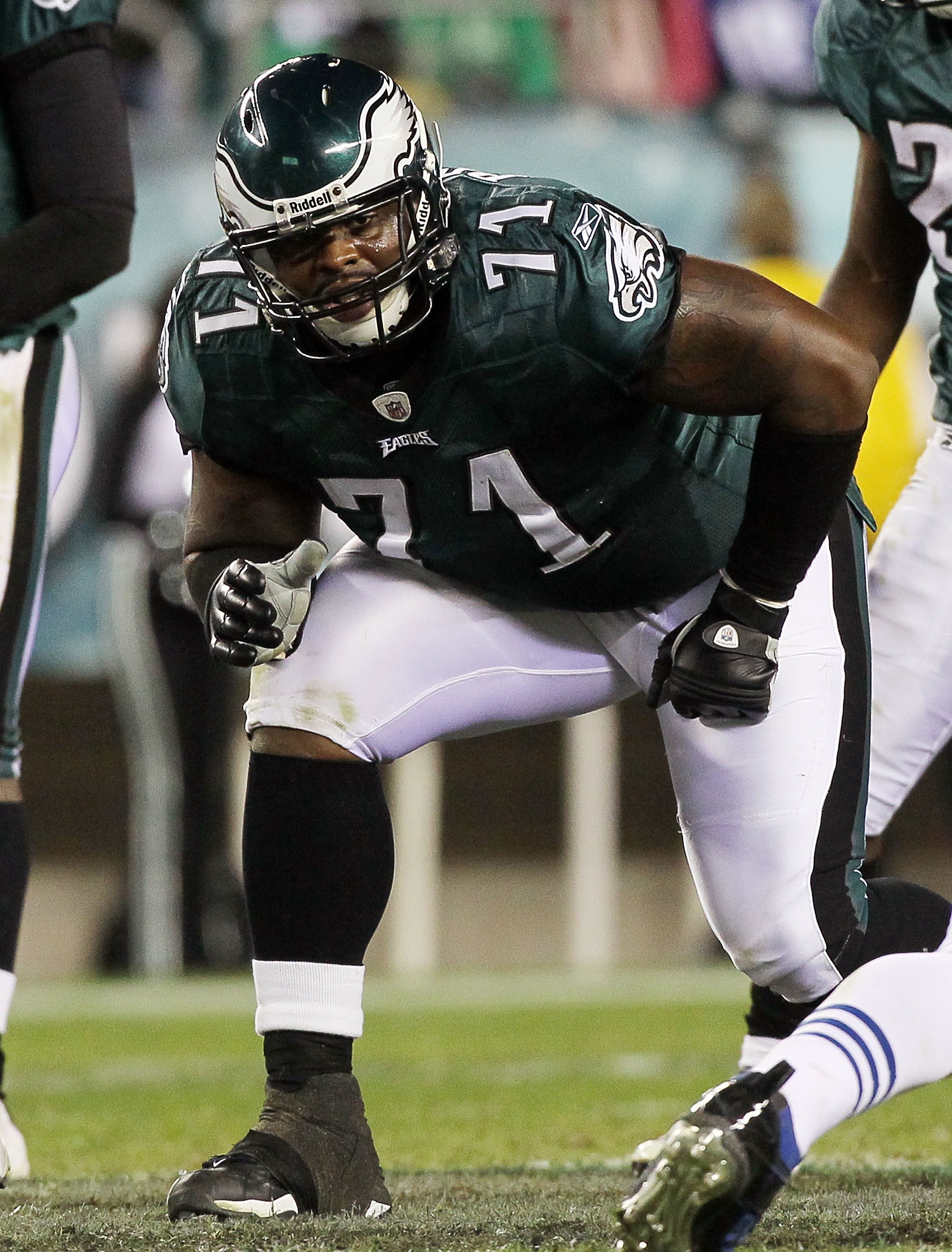 Philadelphia Eagles Joselio Hanson (21) and Stewart Bradley (55) celebrate  an interception by teammate Quintin Mikell (27) against the New York Giants  in the fourth quarter of an NFC Divisional Playoff game.