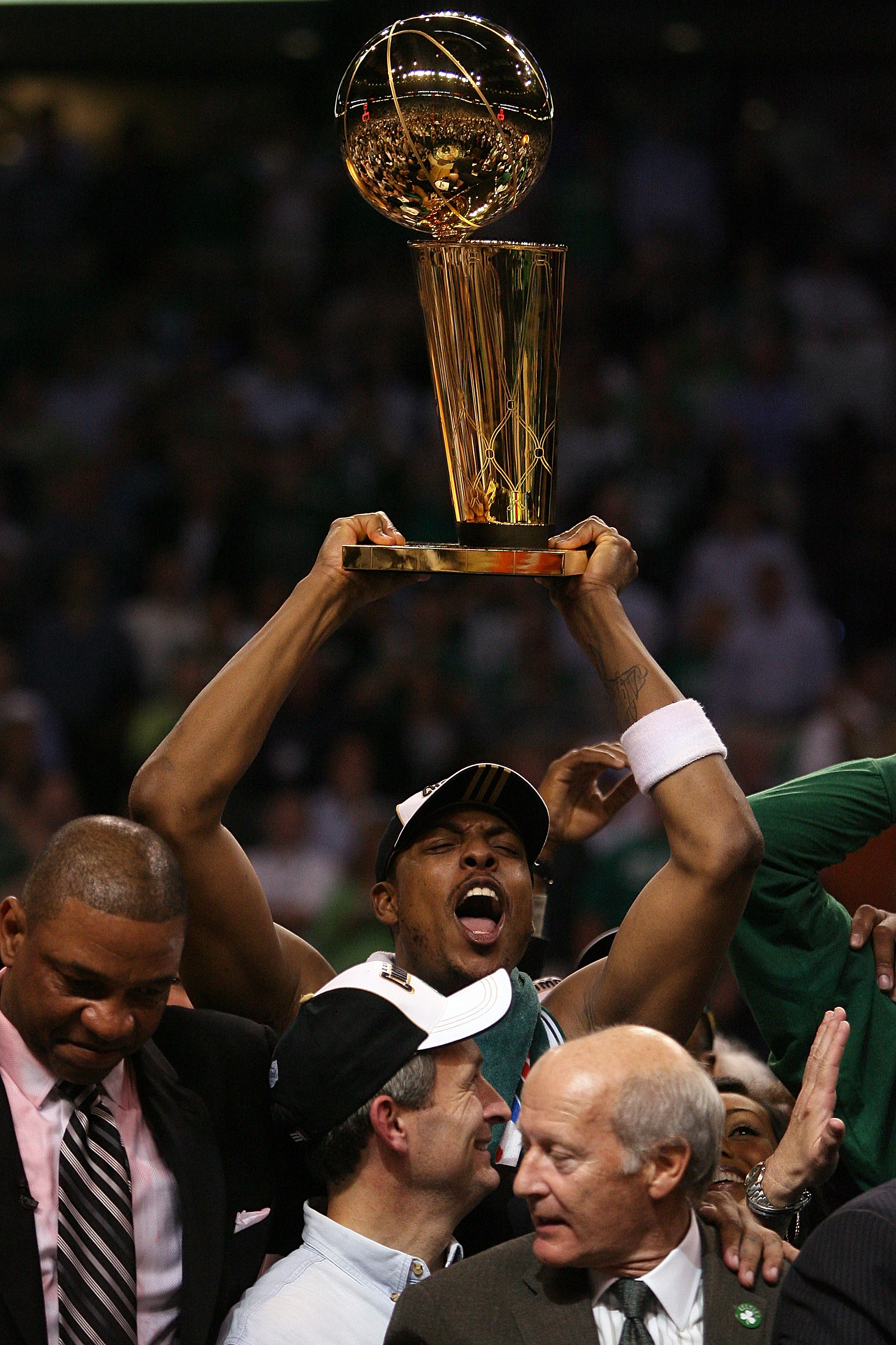 BOSTON - JUNE 17:  Paul Pierce #34 of the Boston Celtics celebrates with the Larry O'Brien Trophy after defeating the Los Angeles Lakers in Game Six of the 2008 NBA Finals on June 17, 2008 at TD Banknorth Garden in Boston, Massachusetts. NOTE TO USER: Use