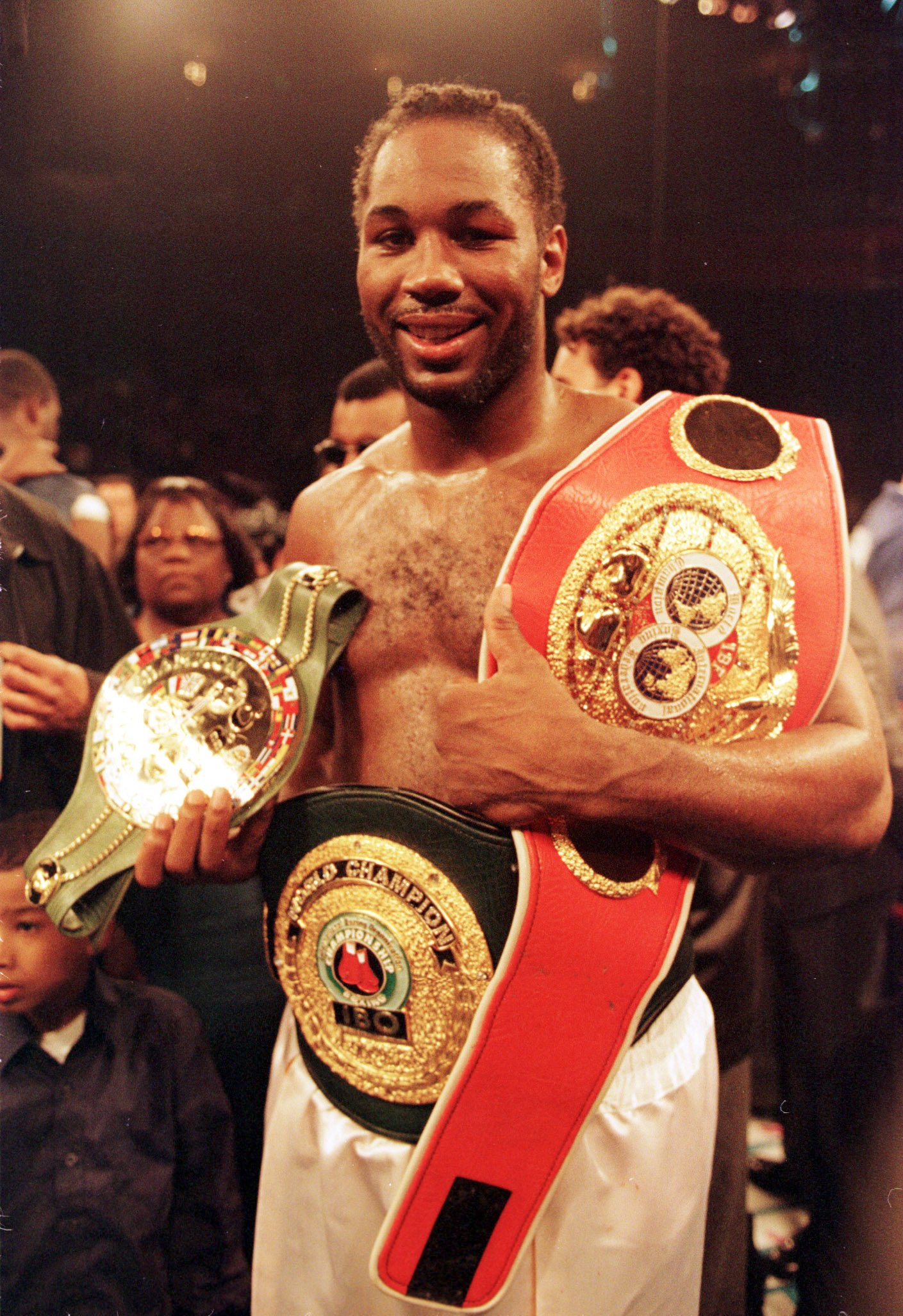 29 Apr 2000: Heavyweight champion Lennox Lewis holds his belts after defeating Michael Grant in the second round of their WBC/IBF Heavyweight fight at Madison Square Garden in New York City. Lewis won by TKO in the second round. Mandatory Credit: Al Bello