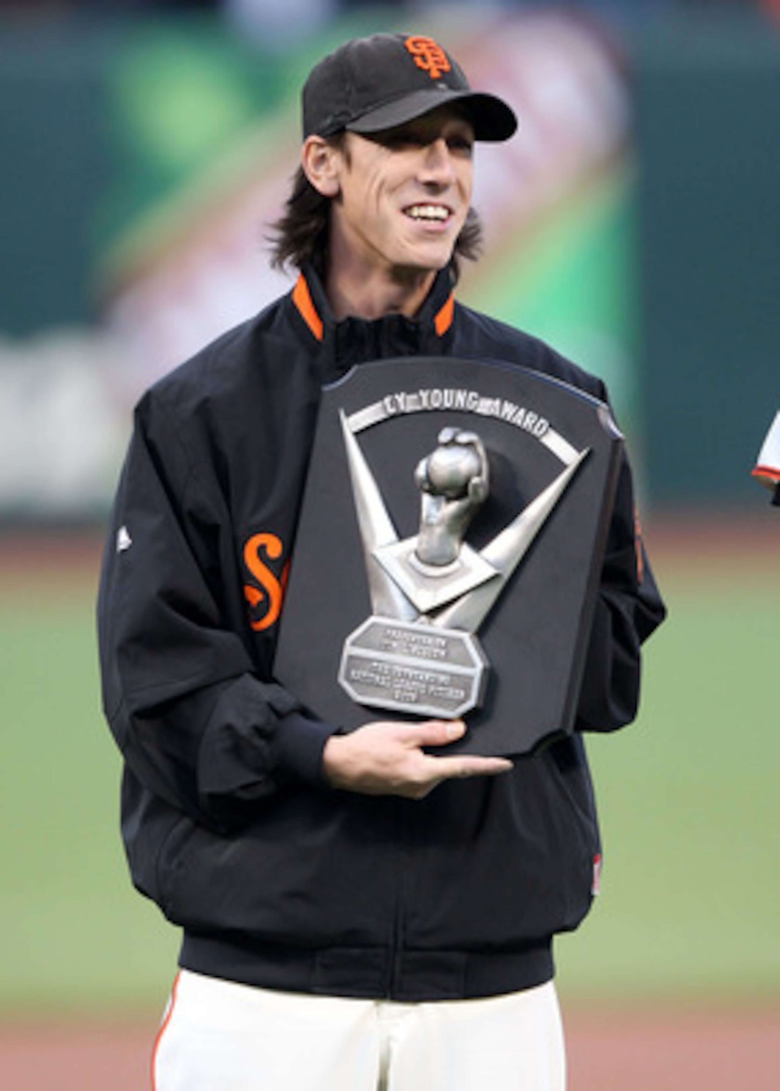 SAN FRANCISCO - APRIL 08: Pitcher Tim Lincecum #55 of the San Francisco Giants celebrates after receiving his 2008 Cy Young award before his game against the Milwaukee Brewers at a Major League Baseball game on April 8, 2009 at AT&T Park in San Francisco SAN FRANCISCO - APRIL 08: Pitcher Tim Lincecum #55 of the San Francisco Giants celebrates after receiving his 2008 Cy Young award before his game against the Milwaukee Brewers at a Major League Baseball game on April 8, 2009 at AT&T Park in San Francisco