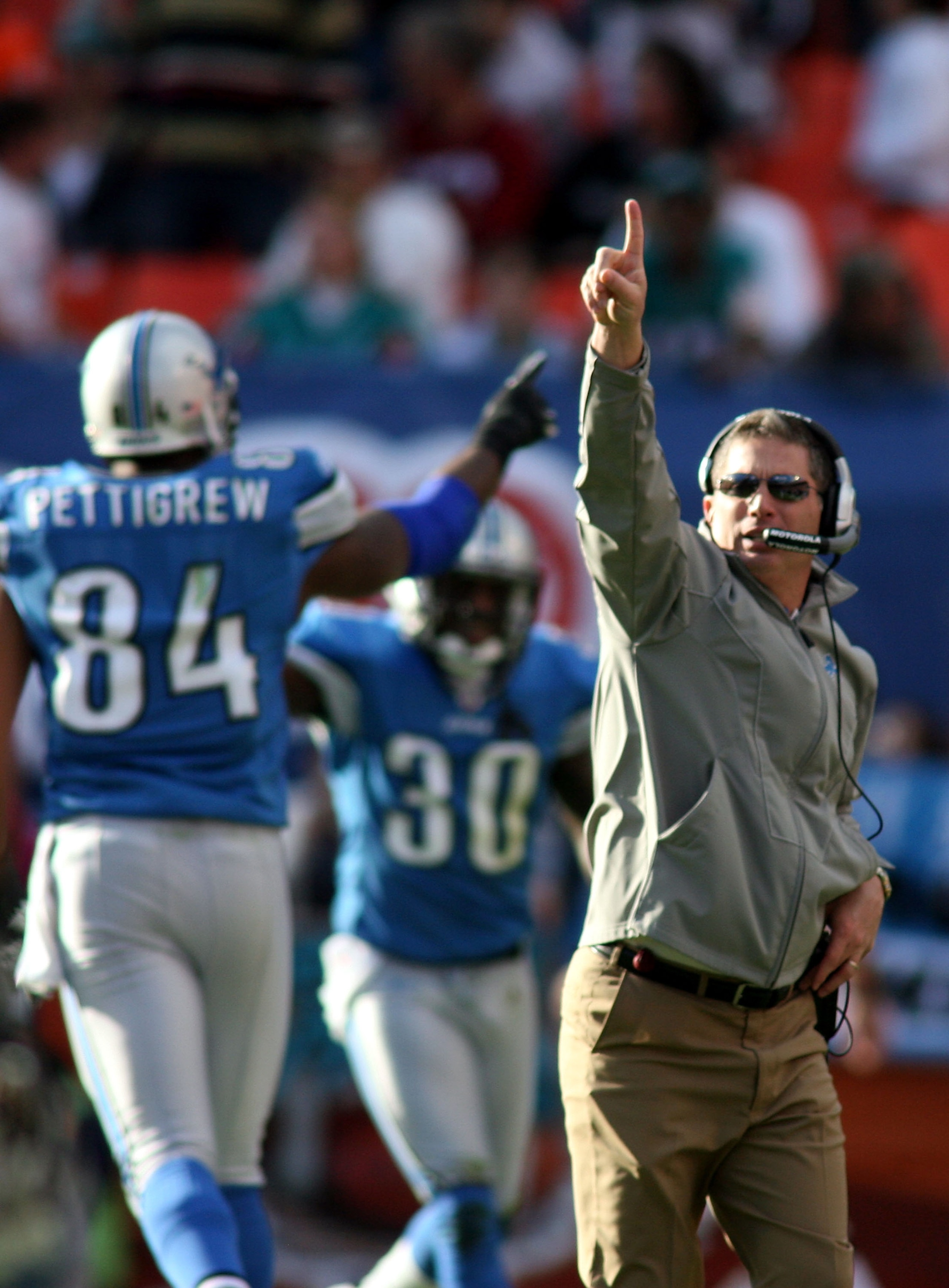 MIAMI - DECEMBER 26: Coach Jim Schwartz of the Detroit Lions celebrates a touchdown against the Miami Dolphins at Sun Life Stadium on December 26, 2010 in Miami, Florida. The Lions defeated the Dolphins 34-27.  (Photo by Marc Serota/Getty Images)