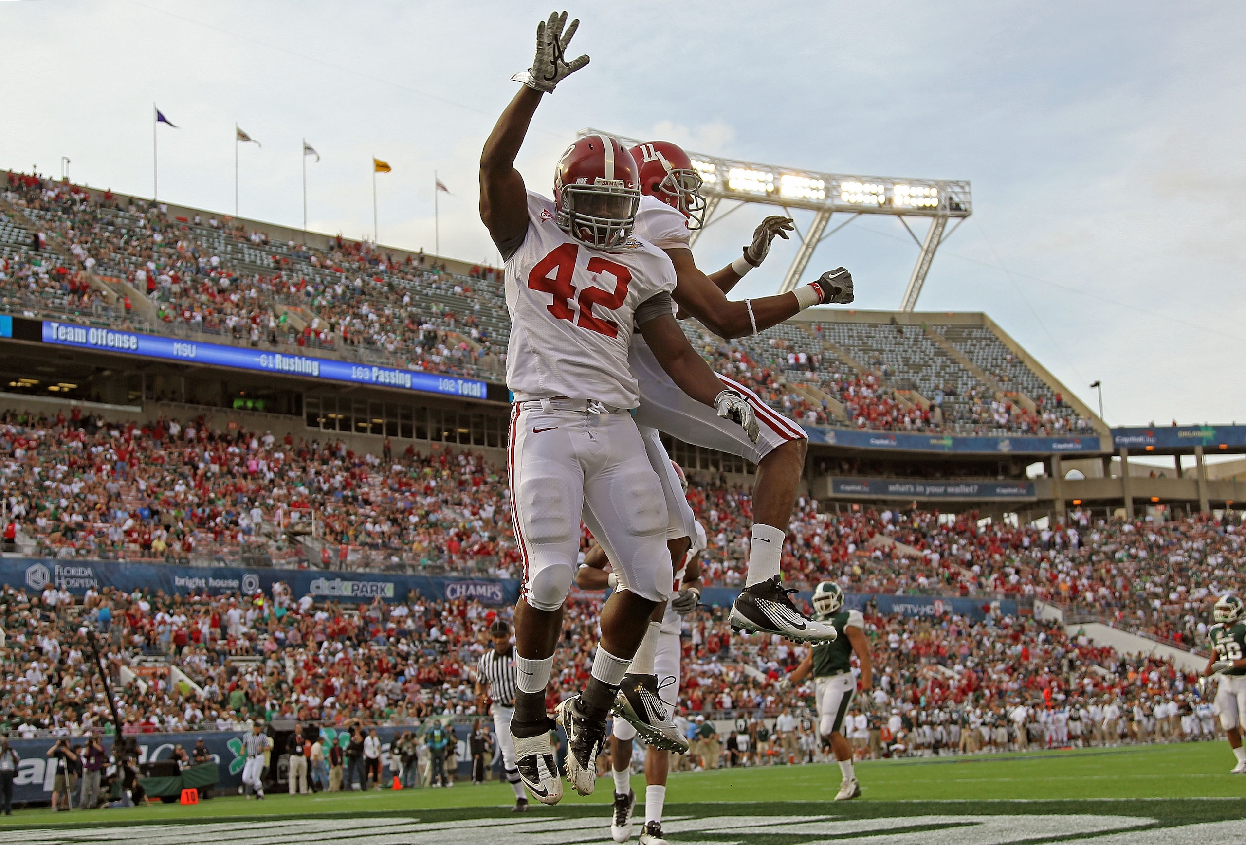 ORLANDO, FL - JANUARY 01:  Eddie Lacy #42 of the Alabama Crimson Tide celebrates after rushing for a touchdown during the Capitol One Bowl against the Michigan State Spartans at the Florida Citrus Bowl on January 1, 2011 in Orlando, Florida.  (Photo by Mi