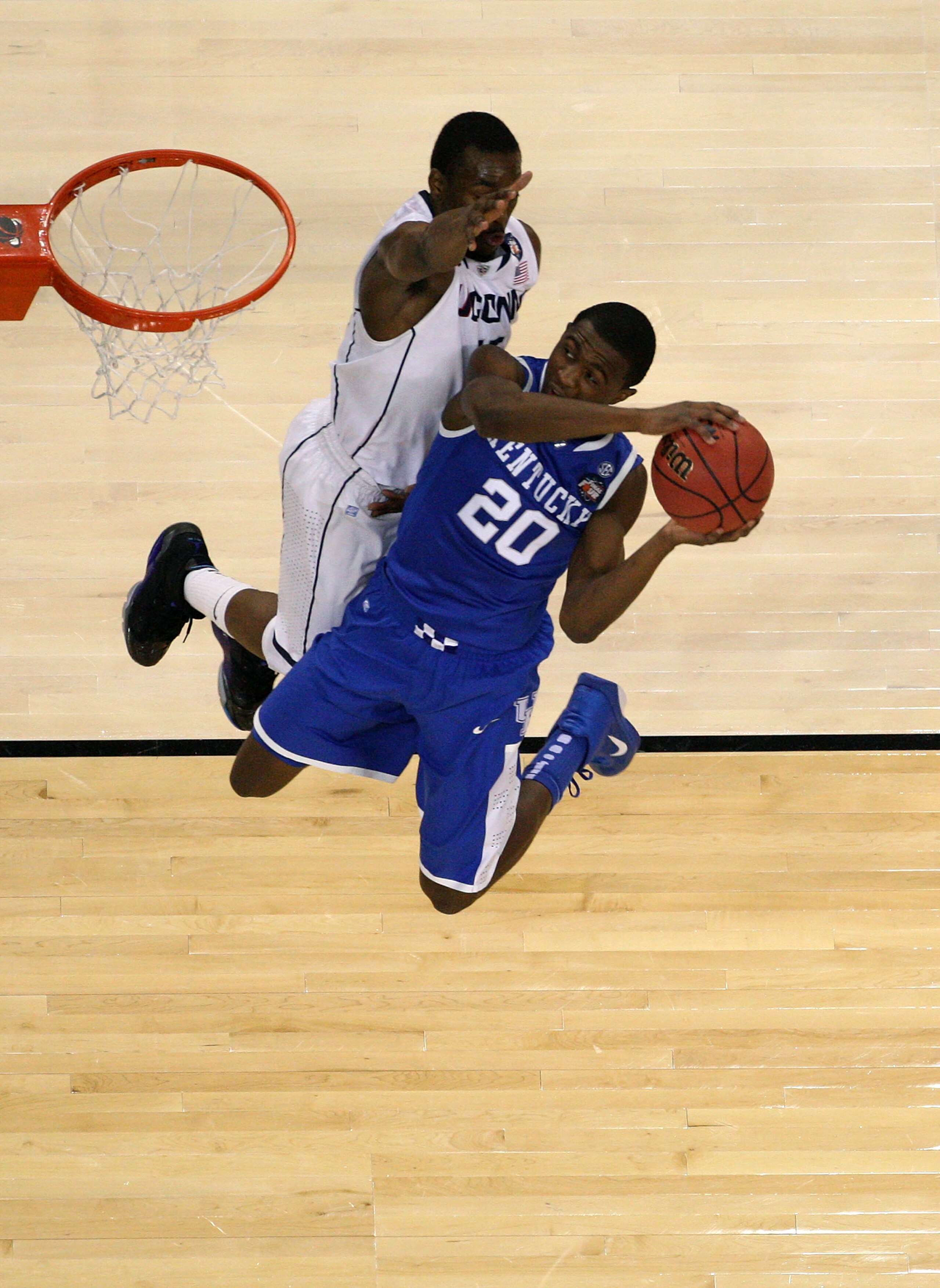 HOUSTON, TX - APRIL 02:  Doron Lamb #20 of the Kentucky Wildcats goes to the hoop against Kemba Walker #15 of the Connecticut Huskies during the National Semifinal game of the 2011 NCAA Division I Men's Basketball Championship at Reliant Stadium on April