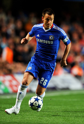 LONDON, ENGLAND - APRIL 06:  John Terry of Chelsea runs with the ball during the UEFA Champions League quarter final first leg match between Chelsea and Manchester United at Stamford Bridge on April 6, 2011 in London, England.  (Photo by Mike Hewitt/Getty