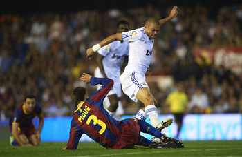 VALENCIA, BARCELONA - APRIL 20: Gerard Pique of Barcelona and Pepe (R) of Real Madrid competes for the ball during the Copa del Rey final match between Real Madrid and Barcelona at Estadio Mestalla on April 20, 2011 in Valencia, Spain. Real Madrid won 1-0