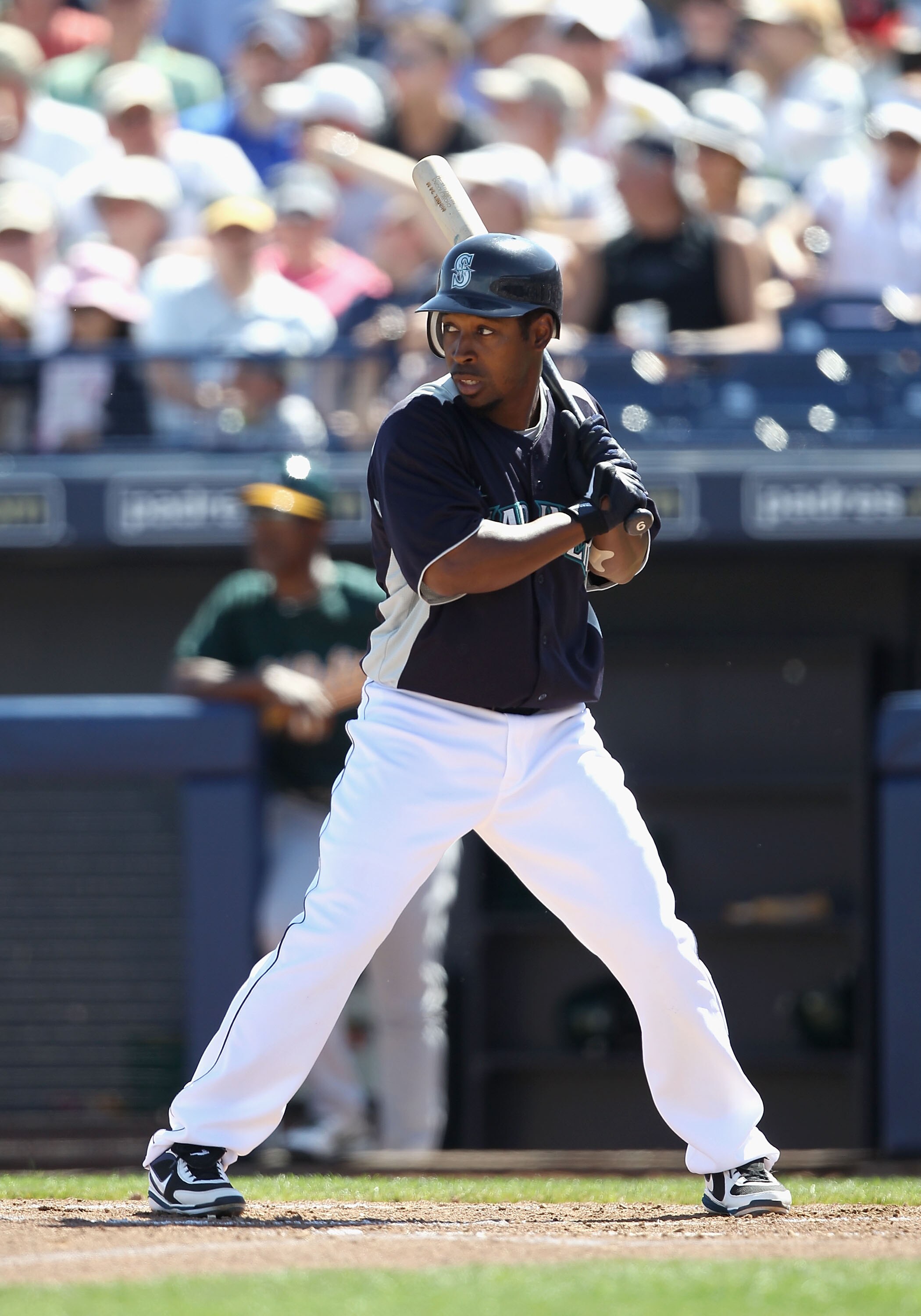 PEORIA, AZ - MARCH 12:  Chone Figgins #9 of the Seattle Mariners bats against the Oakland Athletics during the spring training game at Peoria Stadium on March 12, 2011 in Peoria, Arizona.  (Photo by Christian Petersen/Getty Images)
