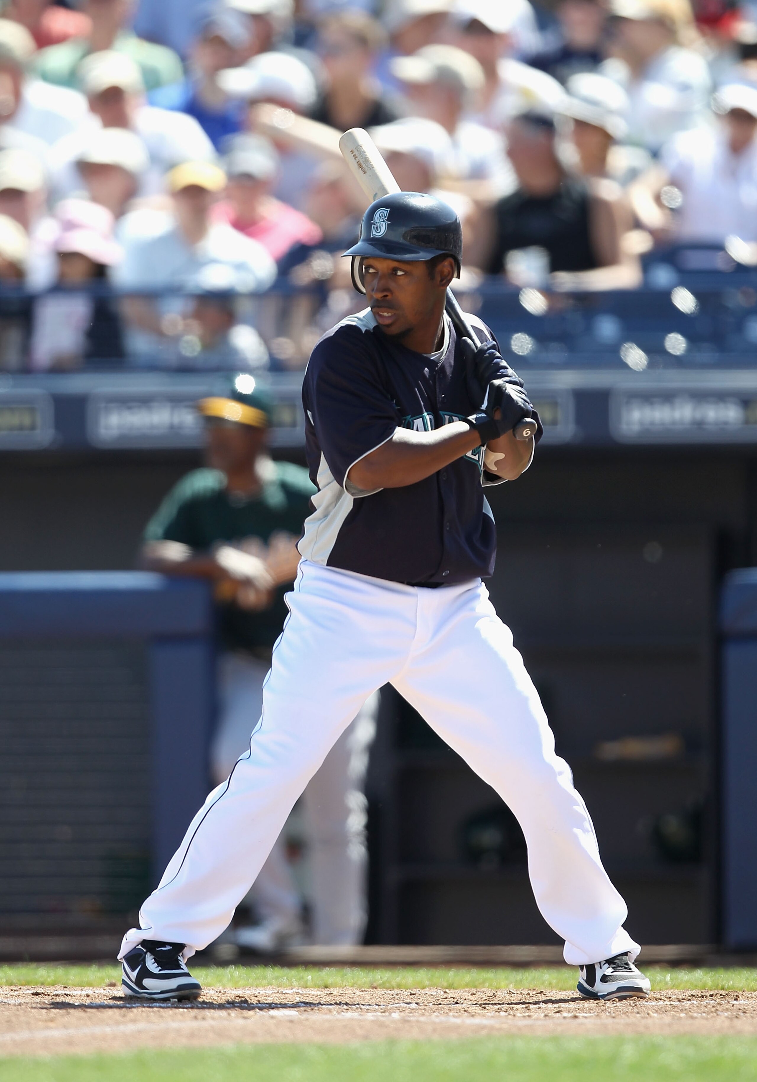 PEORIA, AZ - MARCH 12: Chone Figgins #9 of the Seattle Mariners bats against the Oakland Athletics during the spring training game at Peoria Stadium on March 12, 2011 in Peoria, Arizona. (Photo by Christian Petersen/Getty Images) PEORIA, AZ - MARCH 12: Chone Figgins #9 of the Seattle Mariners bats against the Oakland Athletics during the spring training game at Peoria Stadium on March 12, 2011 in Peoria, Arizona. (Photo by Christian Petersen/Getty Images)