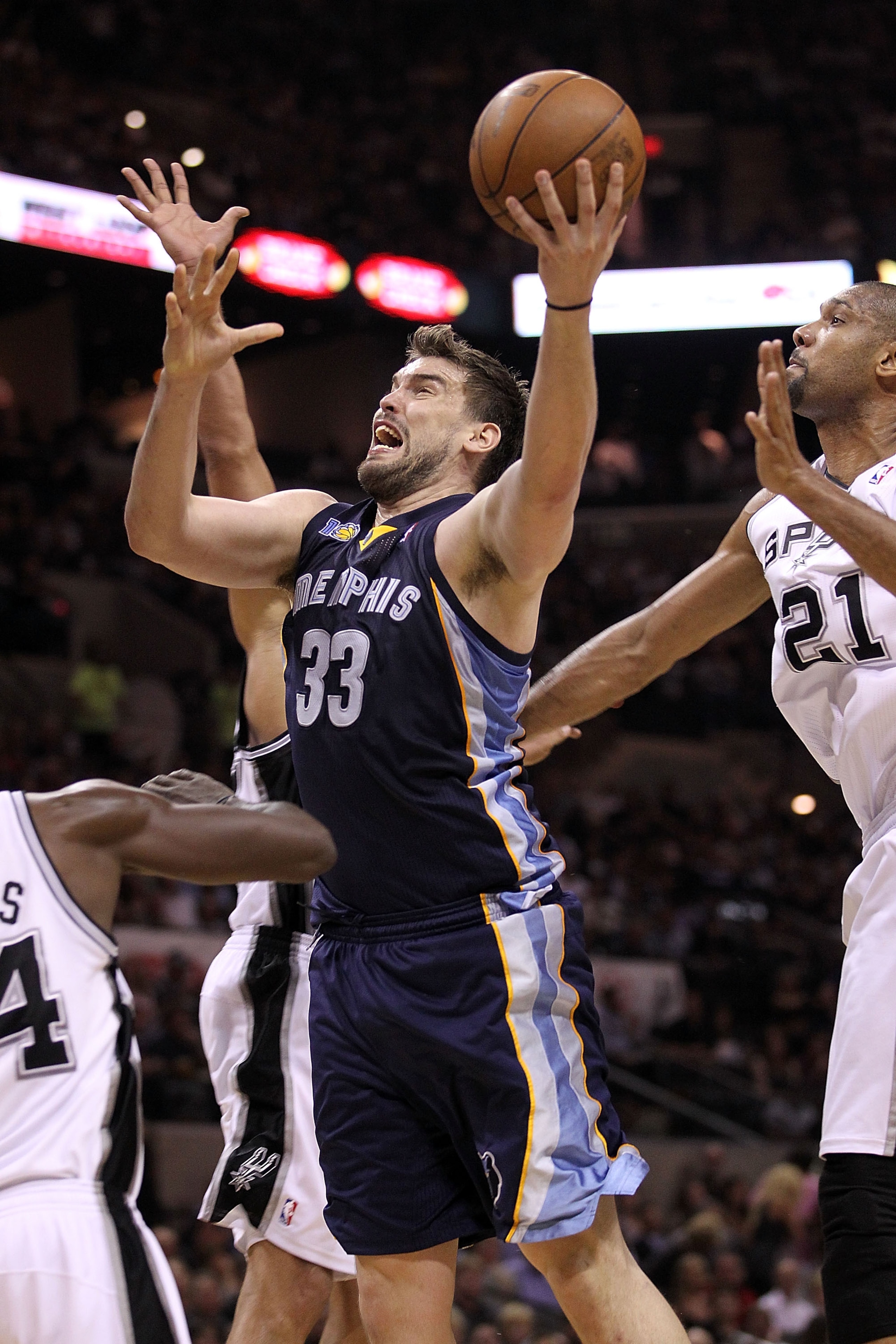 SAN ANTONIO, TX - APRIL 20:  Center Marc Gasol #33 of the Memphis Grizzlies takes a shot against Antonio McDyess #34 of the San Antonio Spurs in Game Two of the Western Conference Quarterfinals in the 2011 NBA Playoffs on April 20, 2011 at AT&T Center in
