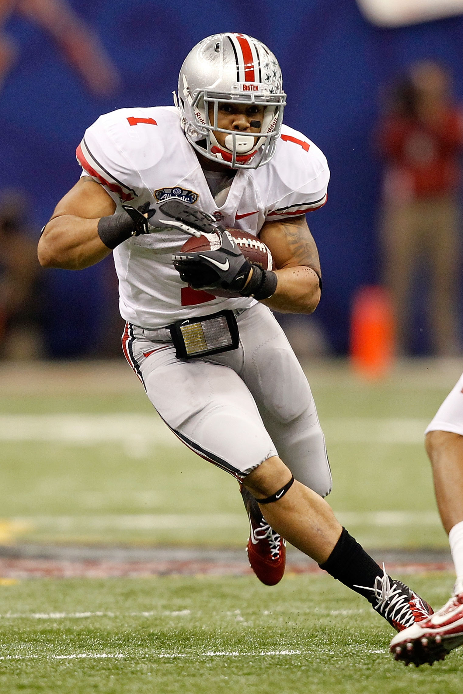 NEW ORLEANS, LA - JANUARY 04:  Dan Herron #1 of the Ohio State Buckeyes runs the ball against the Arkansas Razorbacks during the Allstate Sugar Bowl at the Louisiana Superdome on January 4, 2011 in New Orleans, Louisiana.  (Photo by Matthew Stockman/Getty