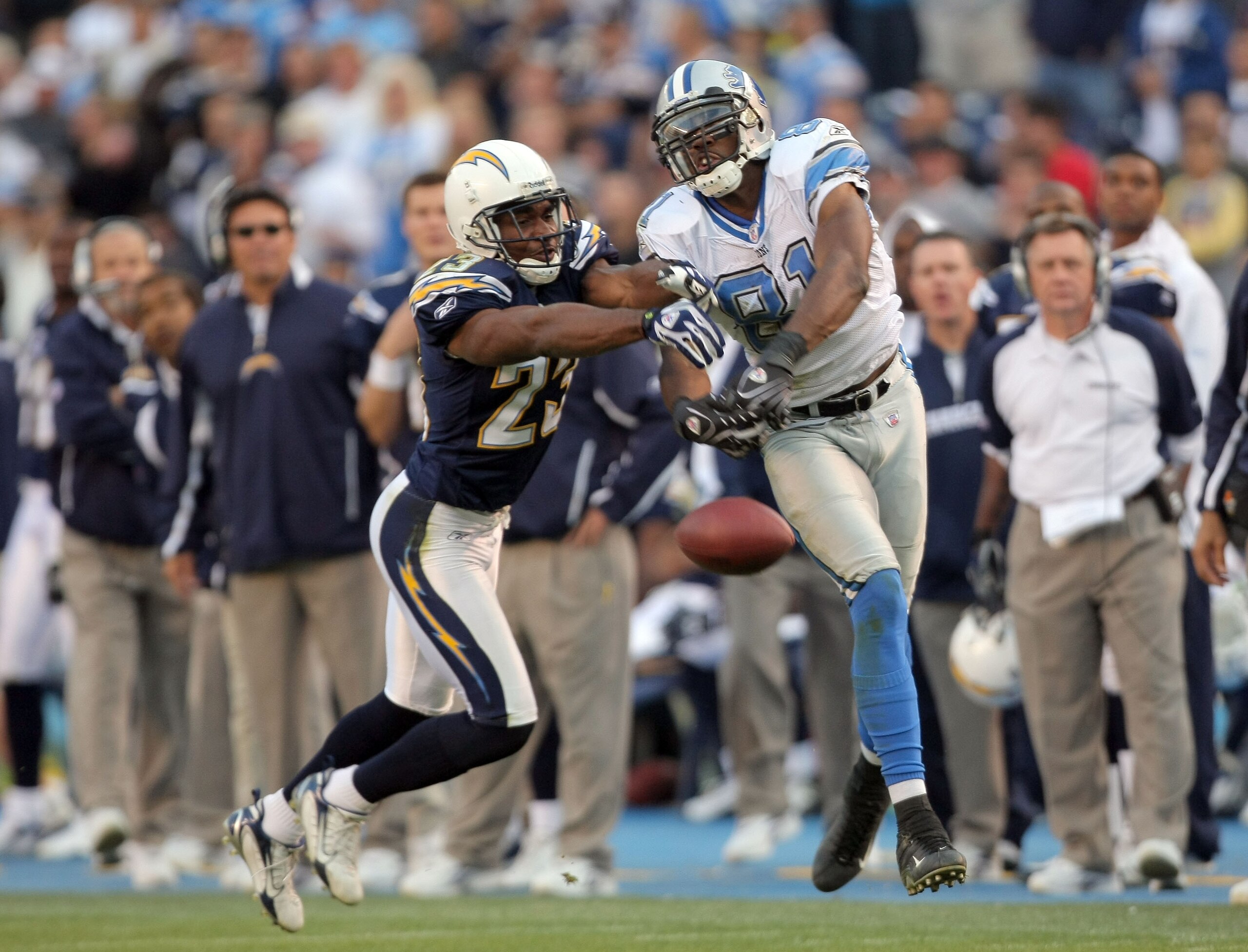 SAN DIEGO - DECEMBER 16:  Calvin Johnson #81 of the Detroit Lions tries to catch a pass as he is defended by Quentin Jammer #23 of the San Diego Chargers during the fourth quarter at Qualcomm Stadium December 16, 2007 in San Diego California.  (Photo by H