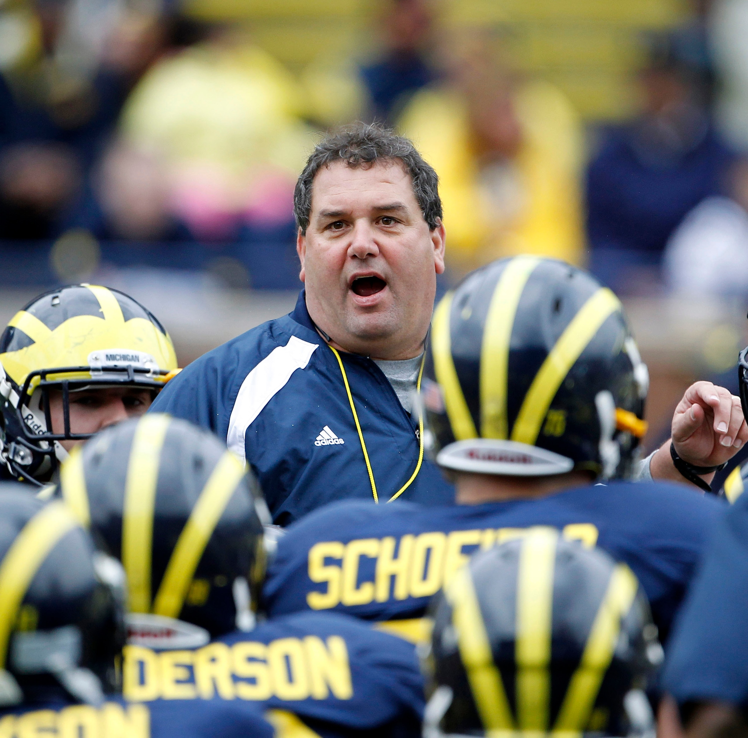 ANN ARBOR, MI - APRIL 16: Head football coach Brady Hoke talks with his team during the annual Spring Game at Michigan Stadium on April 16, 2011 in Ann Arbor, Michigan. (Photo by Leon Halip/Getty Images)