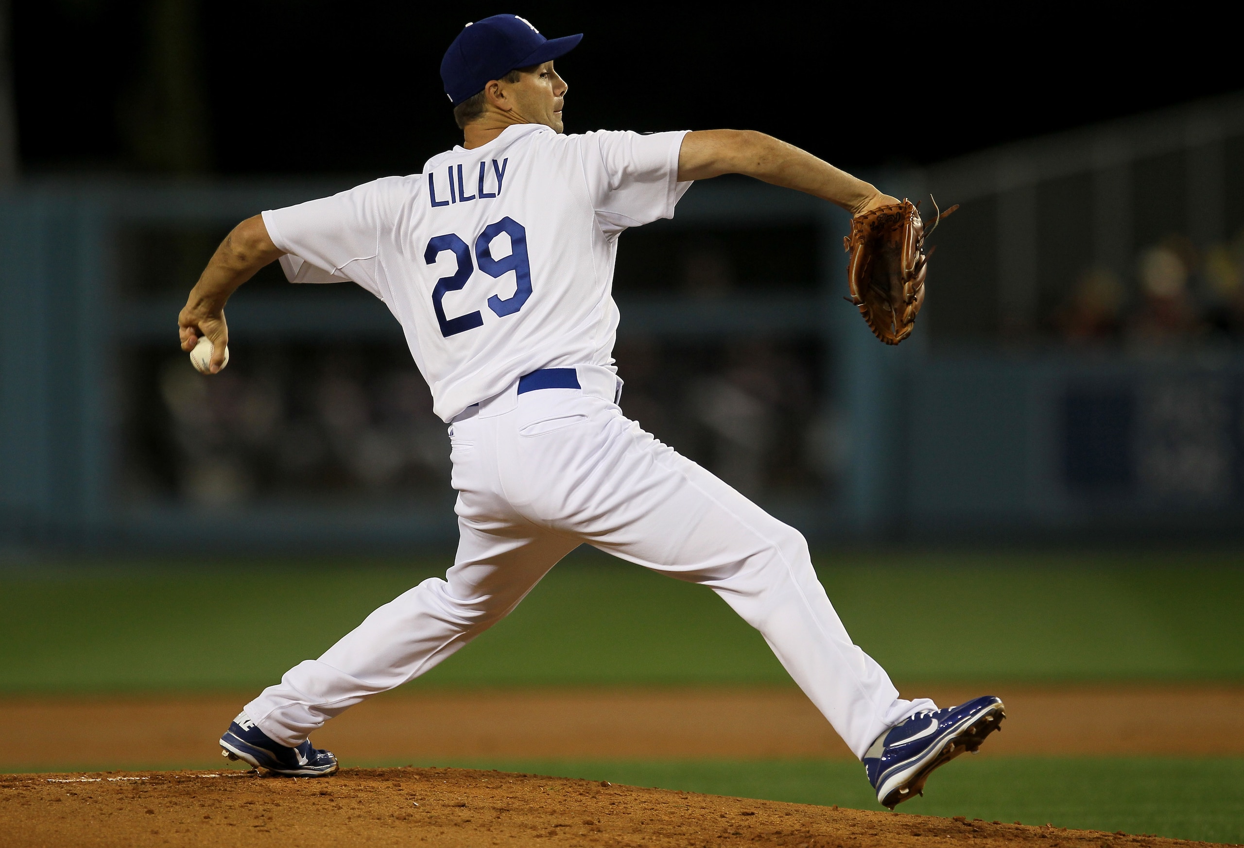 LOS ANGELES, CA - APRIL 18: Ted Lilly #29 of the Los Angeles Dodgersthrows a pitch against the Atlanta Braves on April 18, 2011 at Dodger Stadium in Los Angeles, California. (Photo by Stephen Dunn/Getty Images) LOS ANGELES, CA - APRIL 18: Ted Lilly #29 of the Los Angeles Dodgersthrows a pitch against the Atlanta Braves on April 18, 2011 at Dodger Stadium in Los Angeles, California. (Photo by Stephen Dunn/Getty Images)