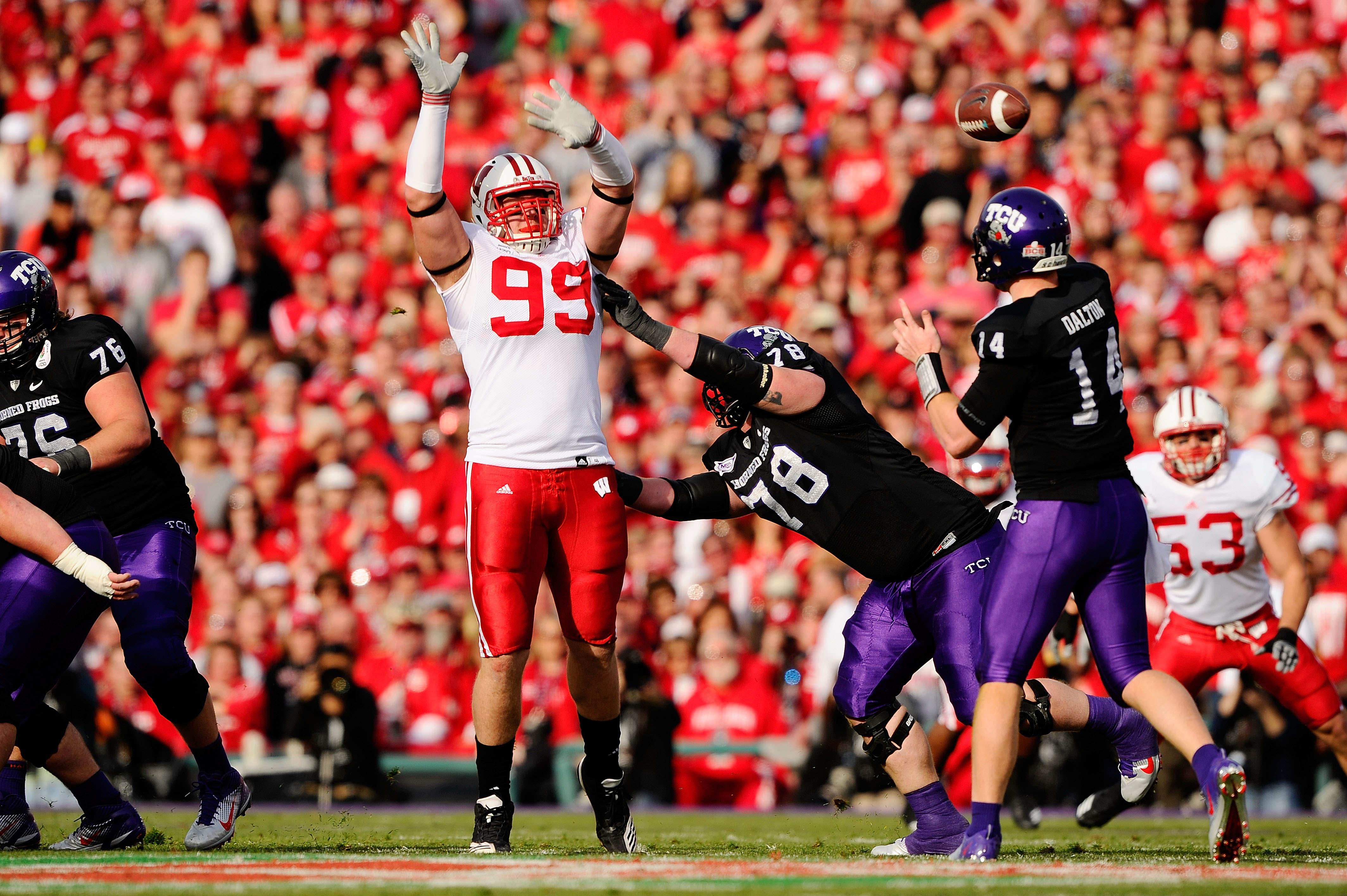 PASADENA, CA - JANUARY 01: Defensive lineman J.J. Watt #99 of the Wisconsin Badgers defends a pass by quarterback Andy Dalton #14 of the TCU Horned Frogs during the 97th Rose Bowl game on January 1, 2011 in Pasadena, California. (Photo by Kevork Djansez PASADENA, CA - JANUARY 01: Defensive lineman J.J. Watt #99 of the Wisconsin Badgers defends a pass by quarterback Andy Dalton #14 of the TCU Horned Frogs during the 97th Rose Bowl game on January 1, 2011 in Pasadena, California. (Photo by Kevork Djansez