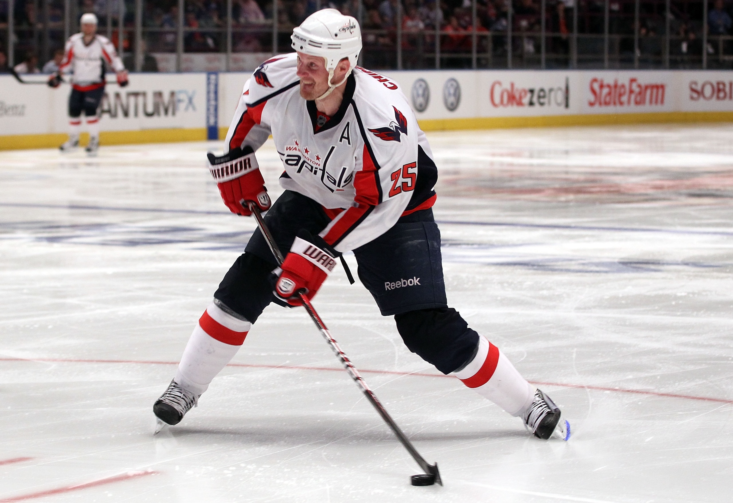 NEW YORK, NY - APRIL 20:  Jason Chimera #25 of the Washington Capitals controls the puck against the New York Rangers in Game Four of the Eastern Conference Quarterfinals during the 2011 NHL Stanley Cup Playoffs at Madison Square Garden on April 20, 2011 