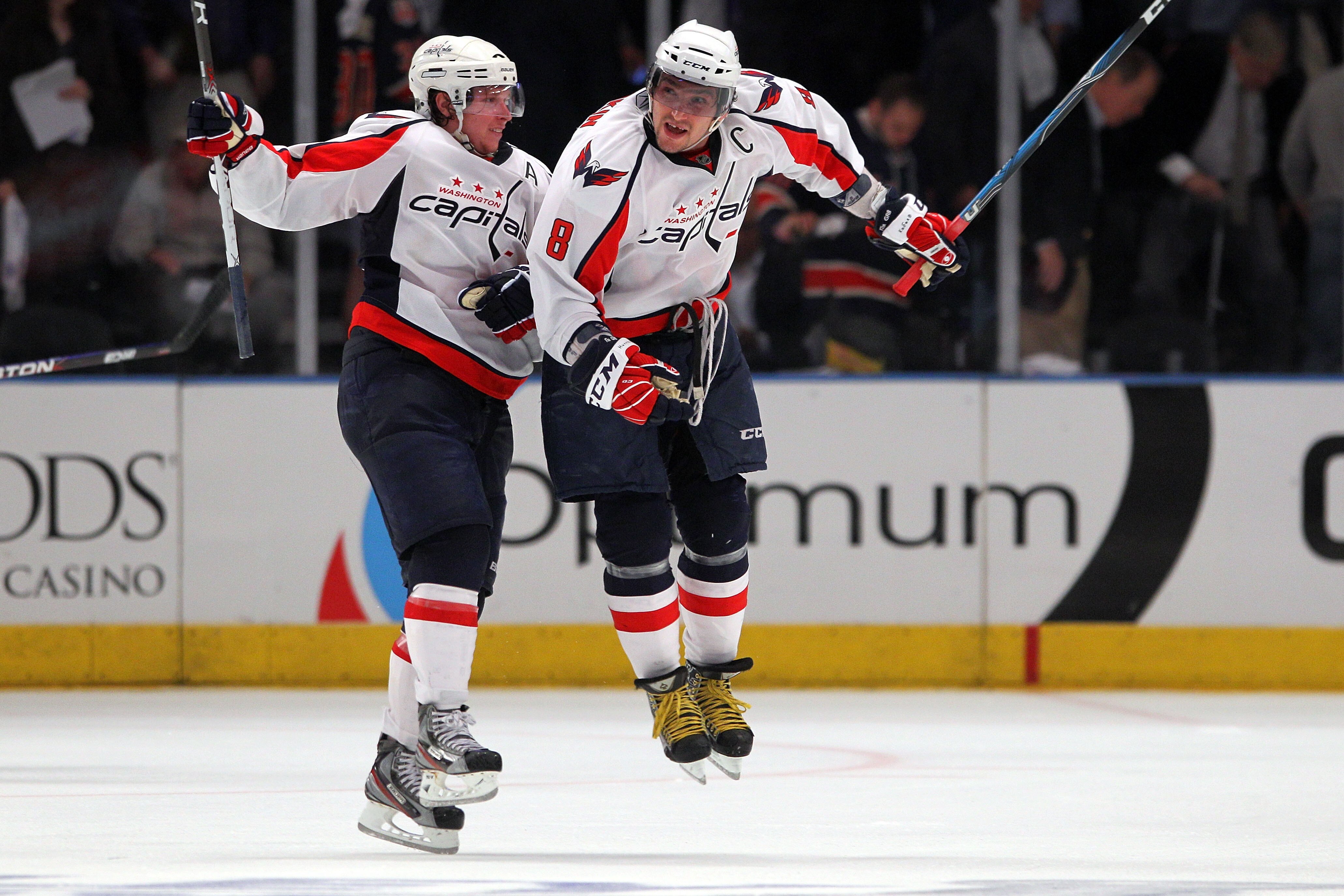 NEW YORK, NY - APRIL 20:  (L-R) Nicklas Backstrom #19 and Alex Ovechkin #8 of the Washington Capitals celebrate after they won 4-3 in the second overtime against the New York Rangers in Game Four of the Eastern Conference Quarterfinals during the 2011 NHL