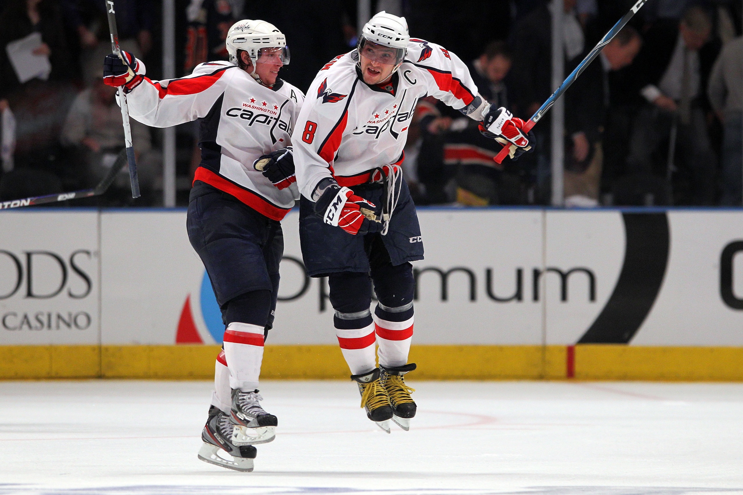NEW YORK, NY - APRIL 20:  (L-R) Nicklas Backstrom #19 and Alex Ovechkin #8 of the Washington Capitals celebrate after they won 4-3 in the second overtime against the New York Rangers in Game Four of the Eastern Conference Quarterfinals during the 2011 NHL