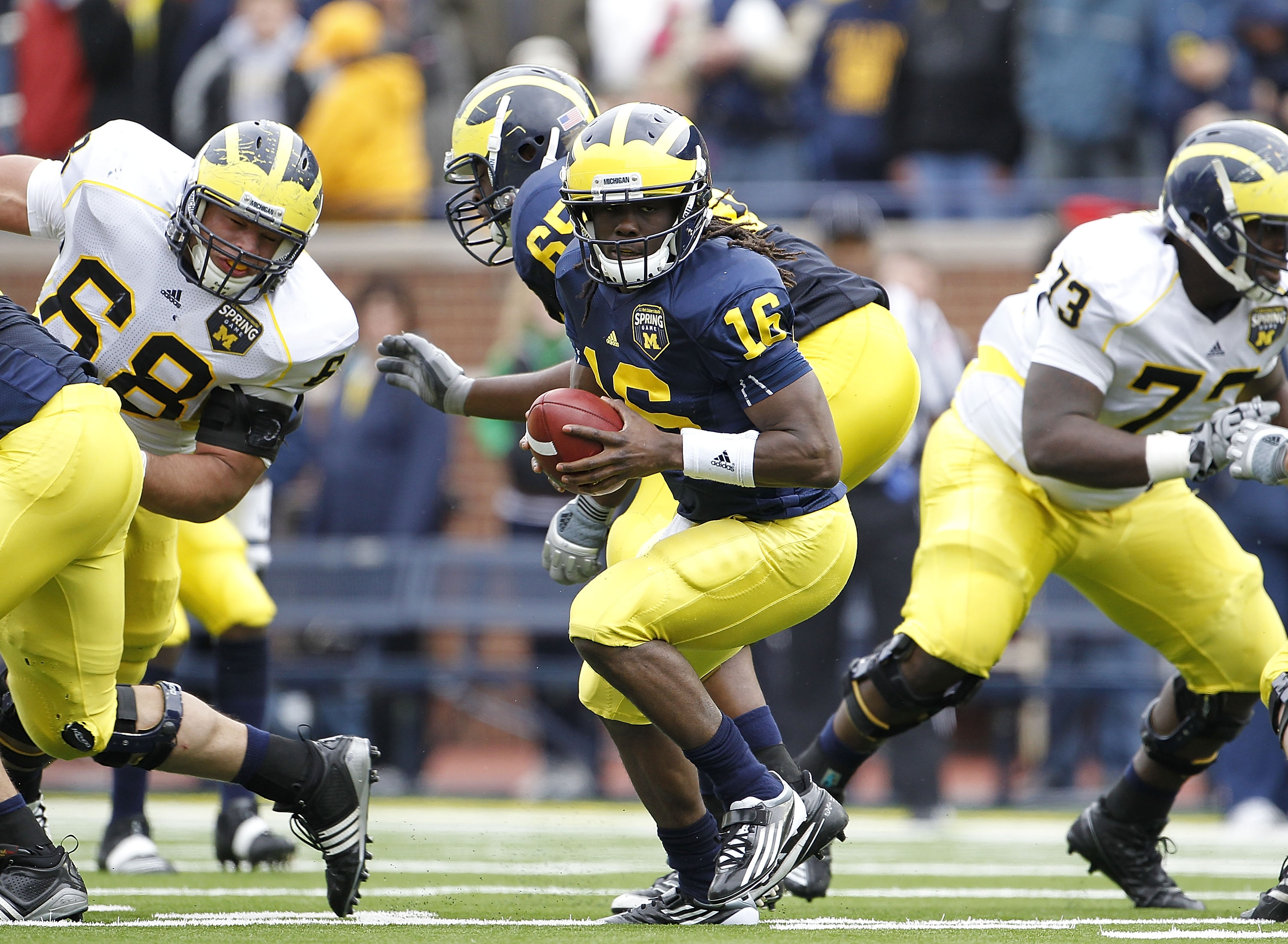 ANN ARBOR, MI - APRIL 16:  Denard Robinson #16 of the Michigan Wolverines runs for a short gain during the annual Spring Game at Michigan Stadium on April 16, 2011 in Ann Arbor, Michigan.  (Photo by Leon Halip/Getty Images)
