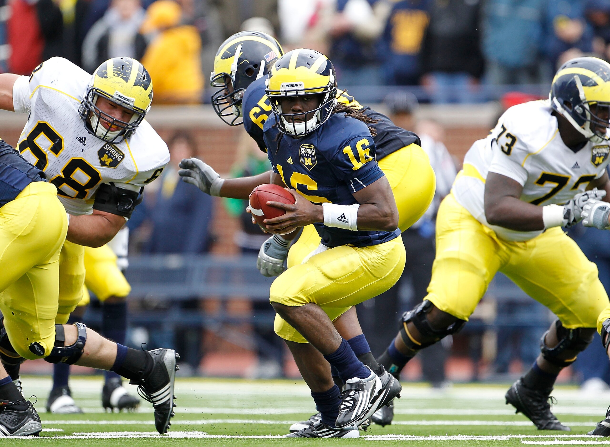 ANN ARBOR, MI - APRIL 16:  Denard Robinson #16 of the Michigan Wolverines runs for a short gain during the annual Spring Game at Michigan Stadium on April 16, 2011 in Ann Arbor, Michigan.  (Photo by Leon Halip/Getty Images)