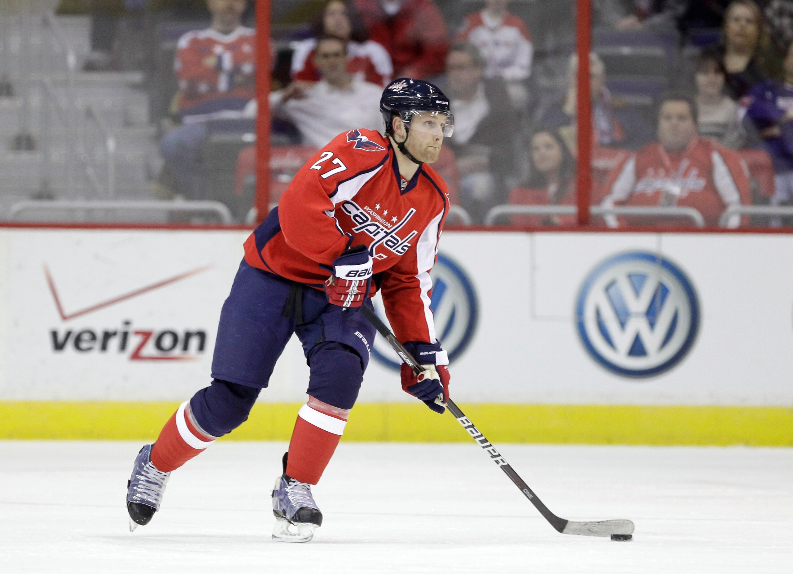 WASHINGTON, DC - MARCH 29:  Karl Alzner #27 of the Washington Capitals skates with the puck against the Carolina Hurricanes at the Verizon Center on March 29, 2011 in Washington, DC.  (Photo by Rob Carr/Getty Images)