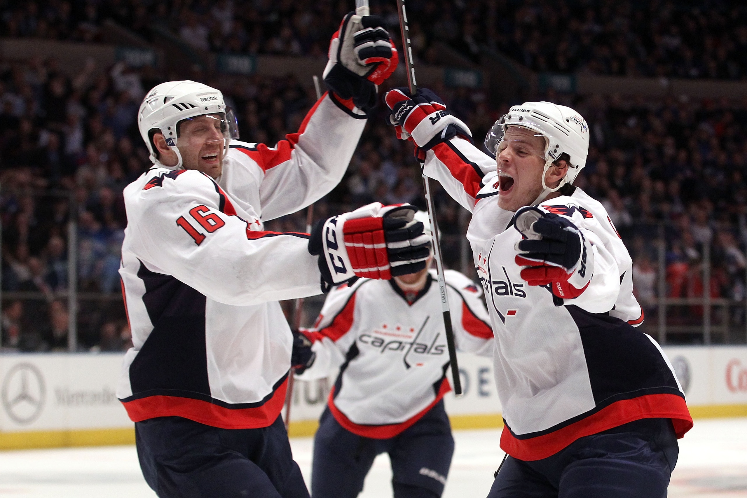NEW YORK, NY - APRIL 20:  (L-R) Eric Fehr #16 and John Carlson #74 of the Washington Capitals celebrate after Marcus Johansson #90 scored a goal in the third period to tie the game 3-3 againsnt the New York Rangers in Game Four of the Eastern Conference Q