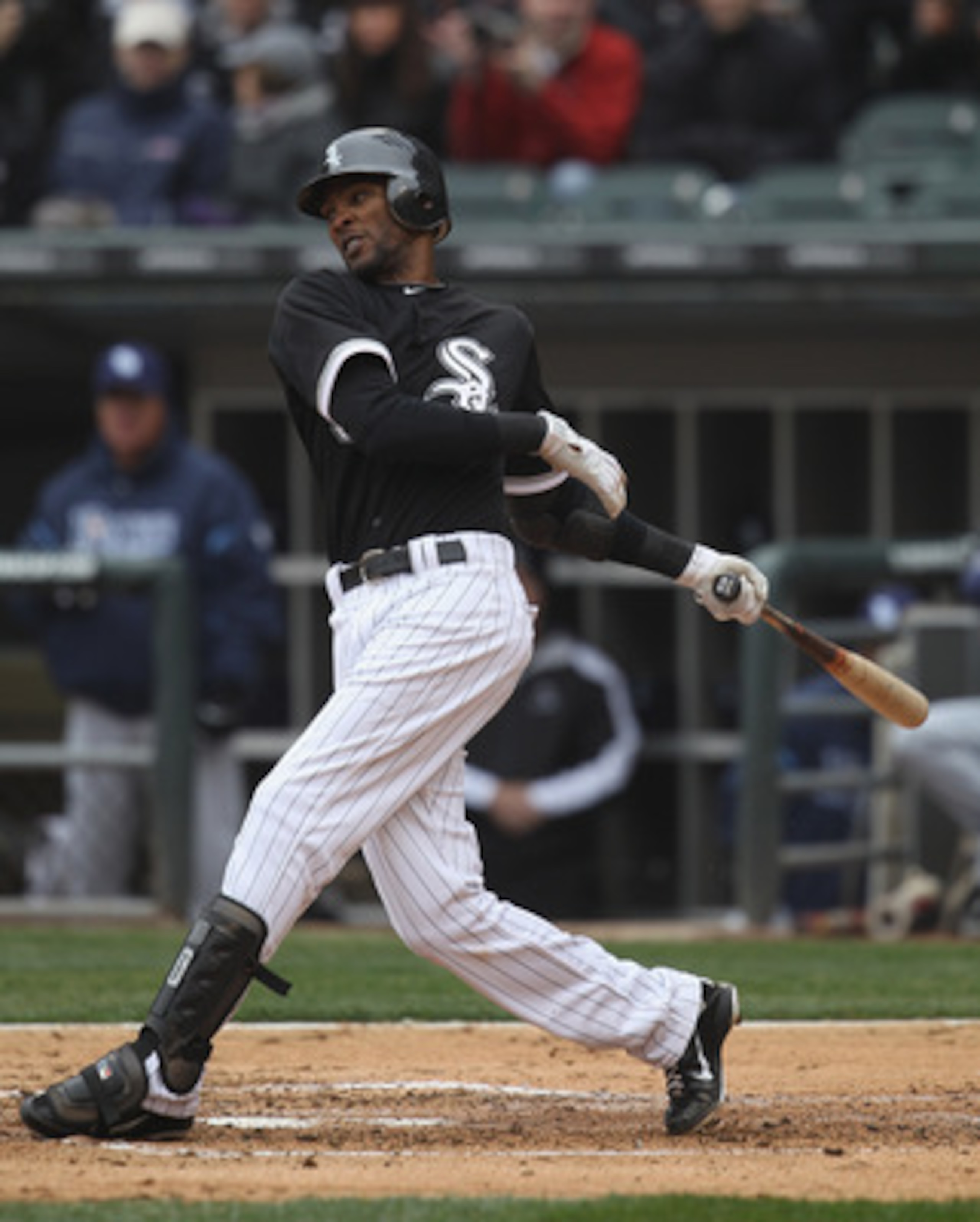 CHICAGO, IL - APRIL 07: Alexei Ramirez #10 of the Chicago White Sox takes a swing against the Tampa Bay Rays during the home opener at U.S. Cellular Field on April 7, 2011 in Chicago, Illinois. The White Sox defeated the Rays 5-1. (Photo by Jonathan Danie