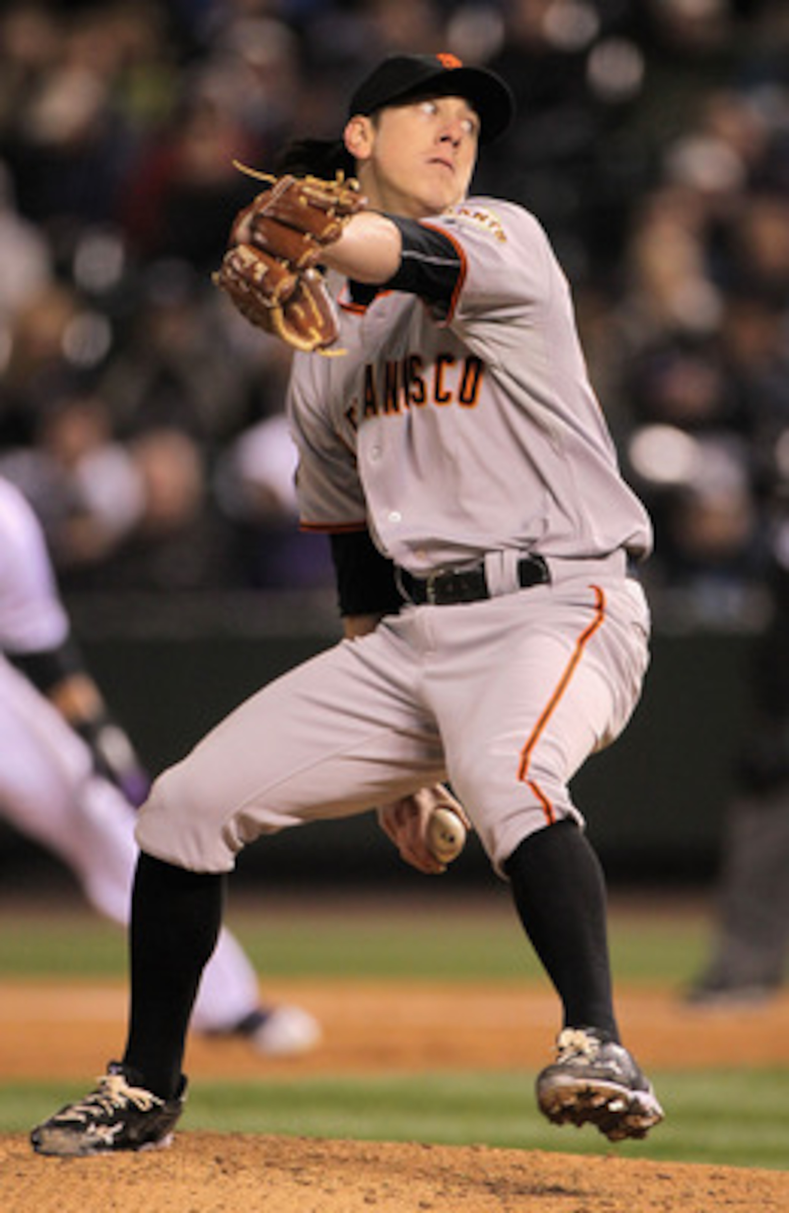 DENVER, CO - APRIL 18:  Starting pitcher Tim Lincecum #55 of the San Francisco Giants delivers against the Colorado Rockies at Coors Field on April 18, 2011 in Denver, Colorado. Lincecum recorded 10 strike outs as he earned the win as the Giants defeated