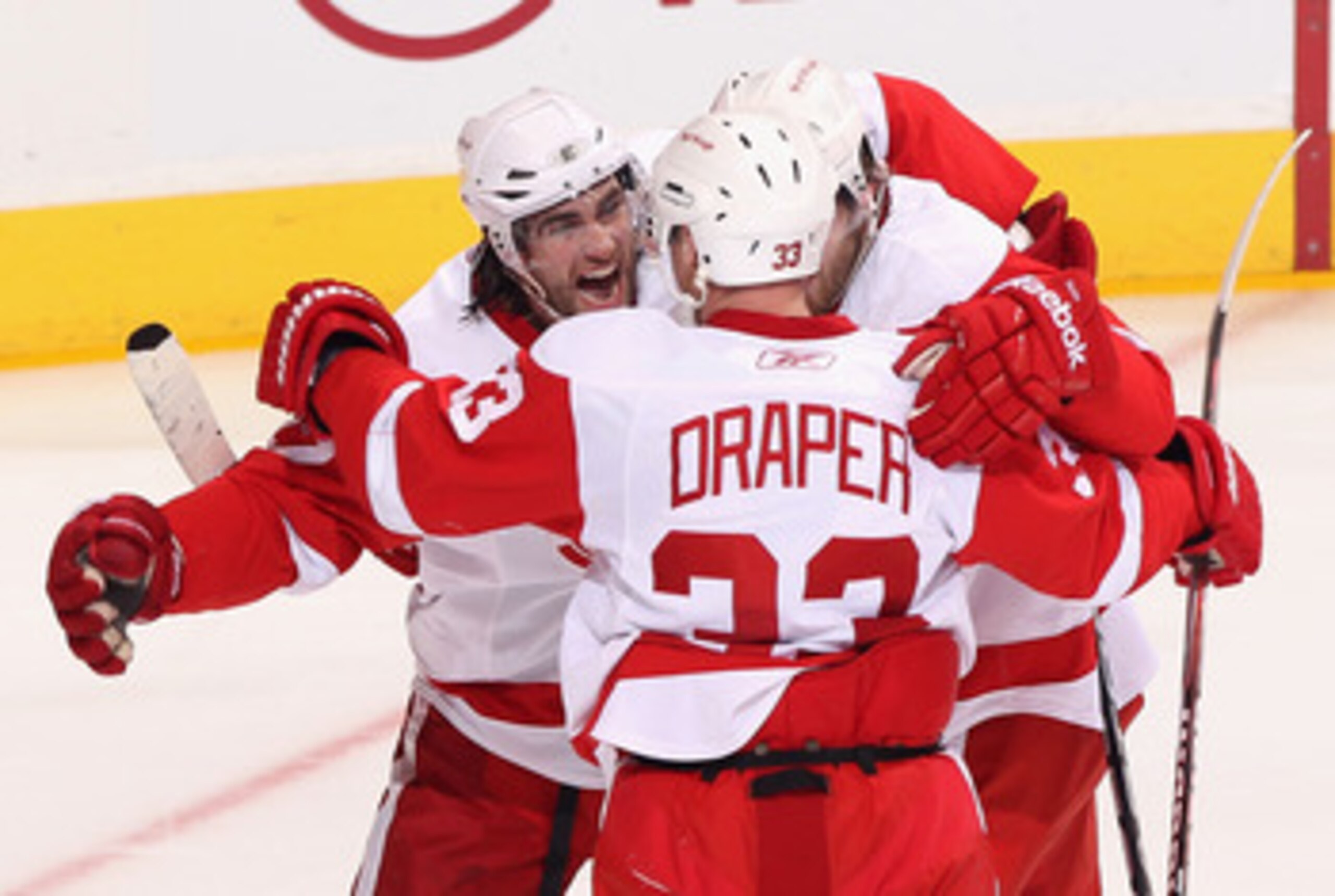GLENDALE, AZ - APRIL 20: Patrick Eaves #17 of the Detroit Red Wings celebrates with teammates Kris Draper #23 and Darren Helm #43 after scoring a first period goal against the Phoenix Coyotes in Game Four of the Western Conference Quarterfinals during th GLENDALE, AZ - APRIL 20: Patrick Eaves #17 of the Detroit Red Wings celebrates with teammates Kris Draper #23 and Darren Helm #43 after scoring a first period goal against the Phoenix Coyotes in Game Four of the Western Conference Quarterfinals during th