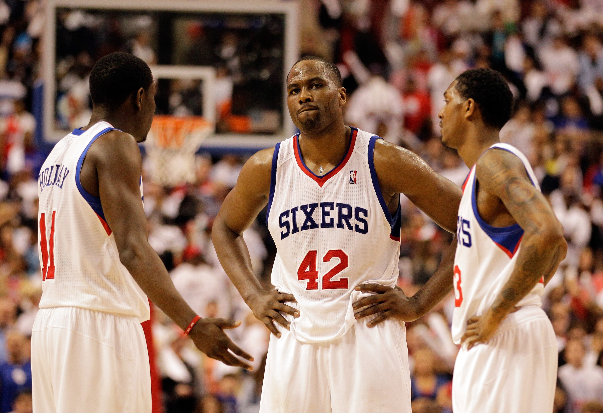 PHILADELPHIA, PA - APRIL 21: Elton Brand #42 of the Philadelphia 76ers talks with teammates Jrue Holiday #11 (L) and Lou Williams #23 (R) during the closing moments of their game against the Miami Heat during game three of the Eastern Conference Quarterf PHILADELPHIA, PA - APRIL 21: Elton Brand #42 of the Philadelphia 76ers talks with teammates Jrue Holiday #11 (L) and Lou Williams #23 (R) during the closing moments of their game against the Miami Heat during game three of the Eastern Conference Quarterf